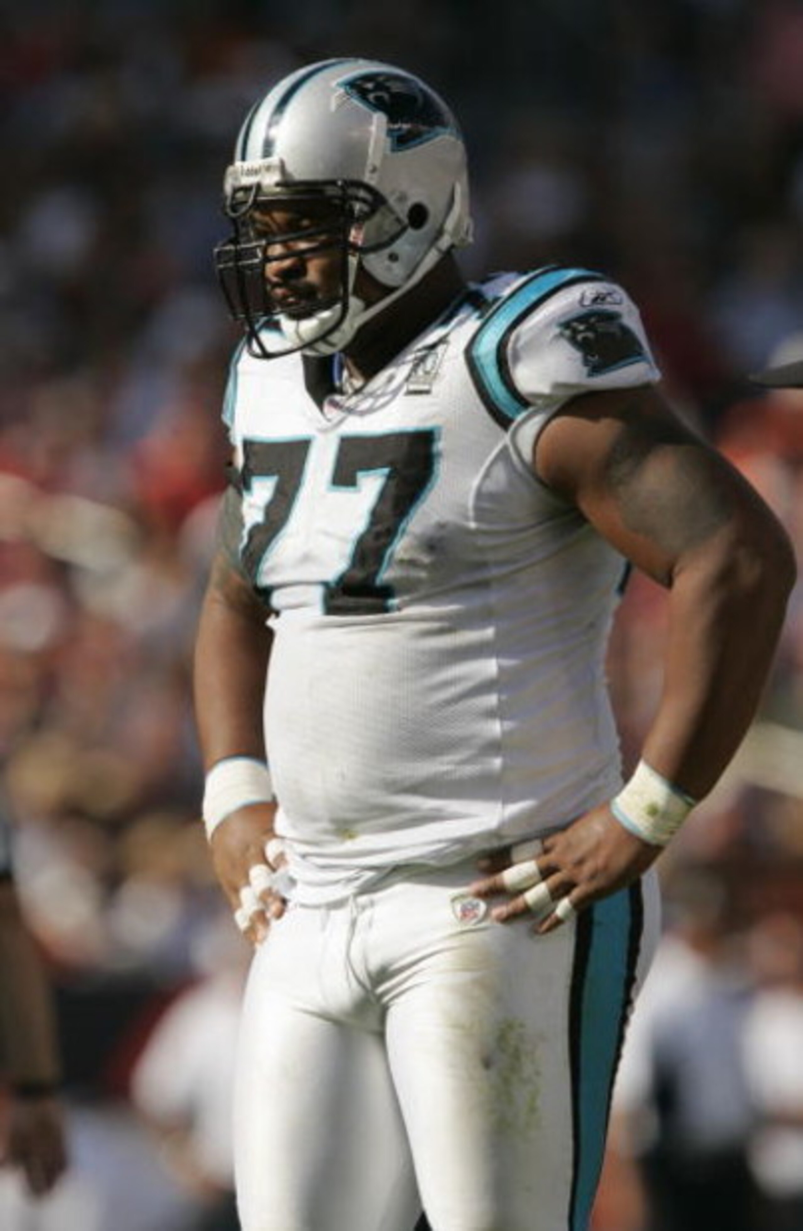 DENVER - OCTOBER 10:  Defensive tackle Kris Jenkins #77 of the Carolina Panthers stands on the field during the game against the Denver Broncos at Invesco Field on October 10, 2004 at Mile High Stadium in Denver, Colorado. The Broncos defeated the Panther