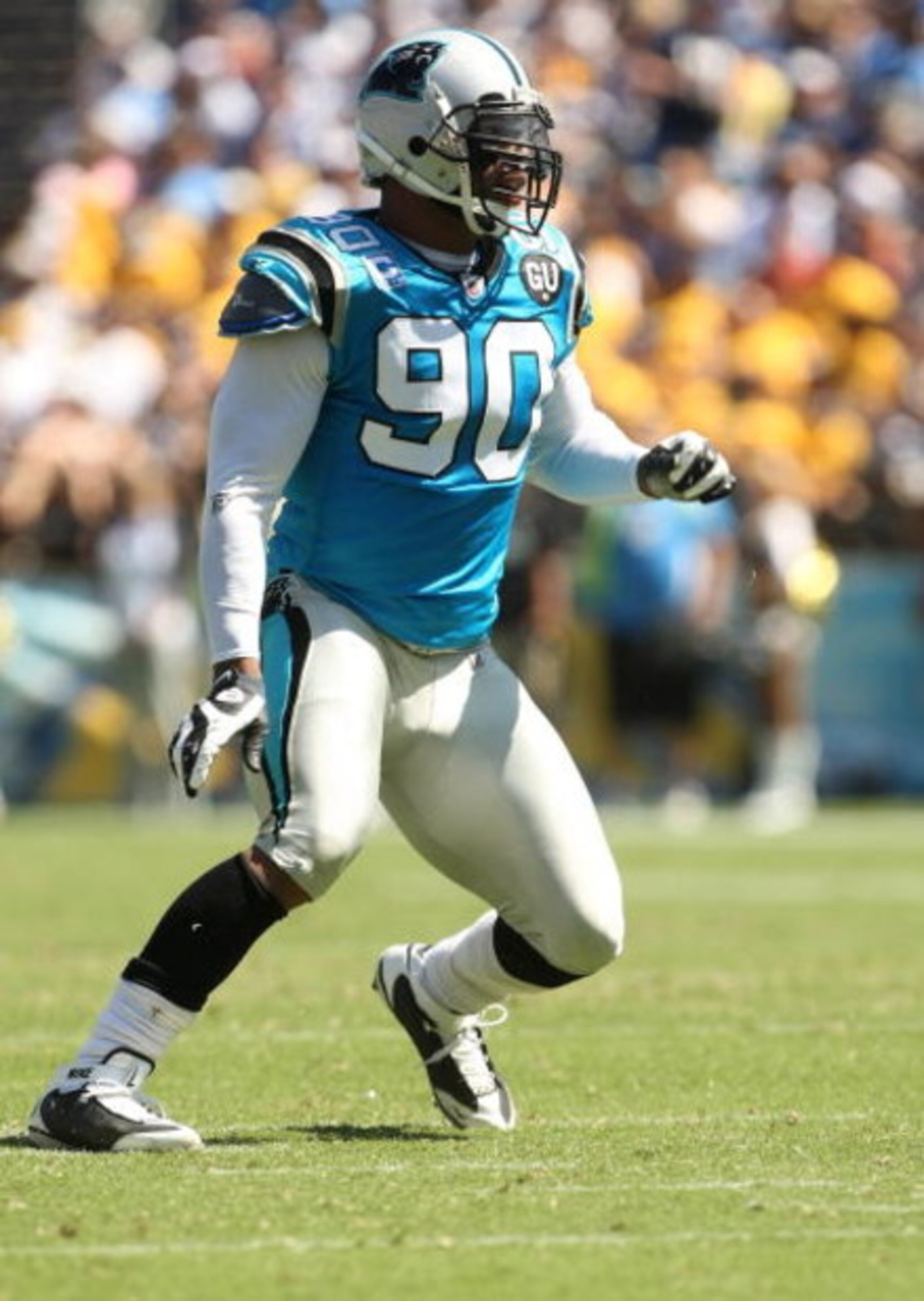 SAN DIEGO - SEPTEMBER 07:  Defensive end Julius Peppers #90 of the Carolina Panthers comes off the line of scrimmage against the San Diego Chargers on September 7, 2008 at Qualcomm Stadium in San Diego, California. The Panthers won 26-24.  (Photo by Steph