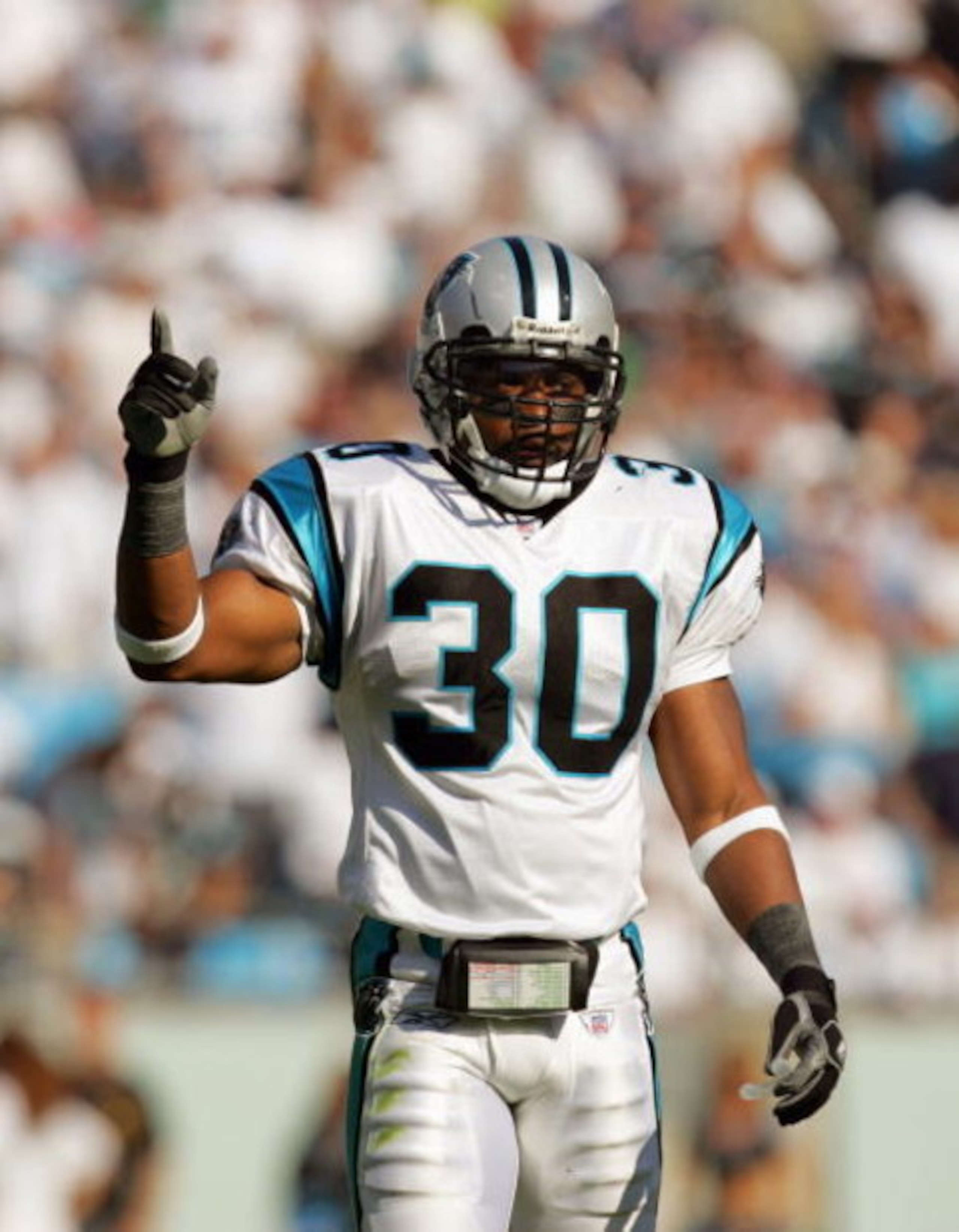 CHARLOTTE, NC - OCTOBER 1: Mike Minter #30 of the Carolina Panthers motions on the field during the game against the New Orleans Saints on October 1, 2006 at Bank of America Stadium in Charlotte, North Carolina.  (Photo By Streeter Lecka/Getty Images)