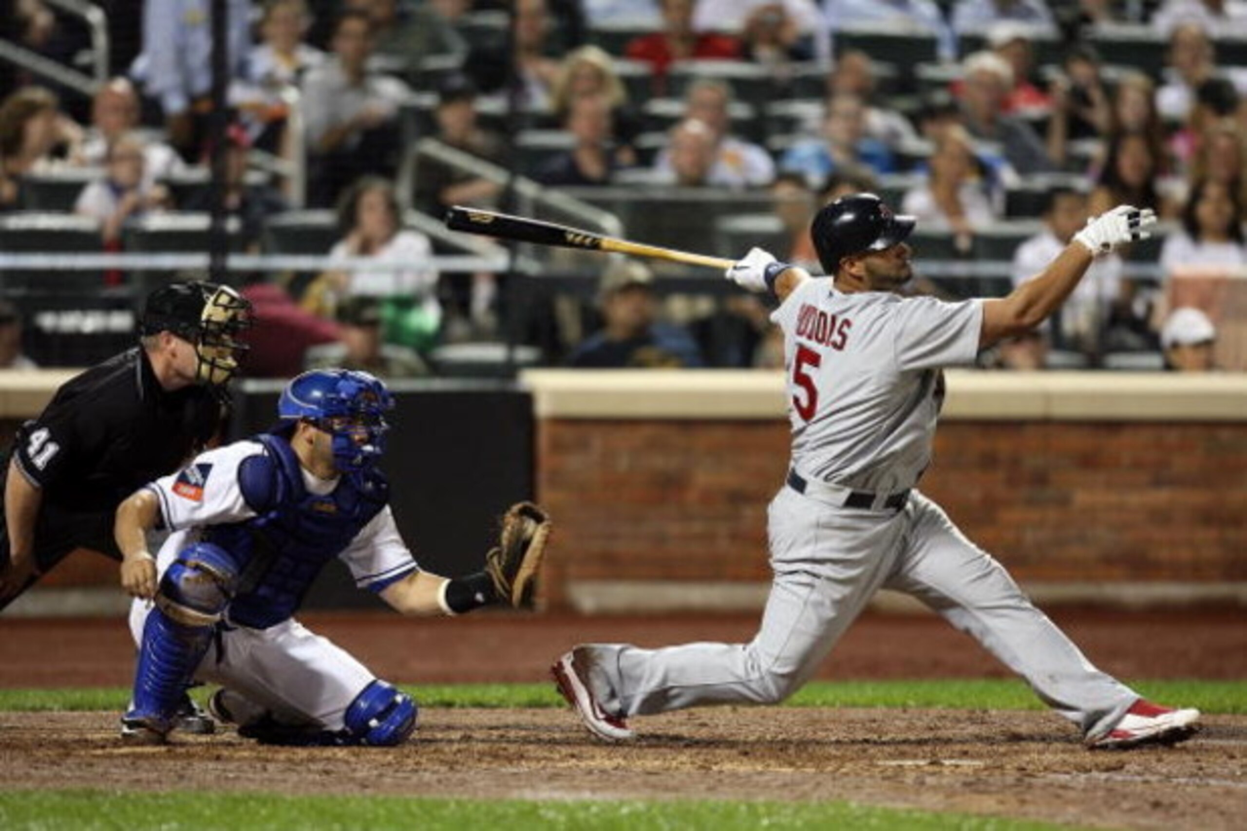NEW YORK - JUNE 23:  Albert Pujols #5 of the St. Louis Cardinals strikes out against the New York Mets at Citi Field on June 23, 2009 in the Flushing neighborhood of the Queens borough of New York City.  (Photo by Michael Heiman/Getty Images)