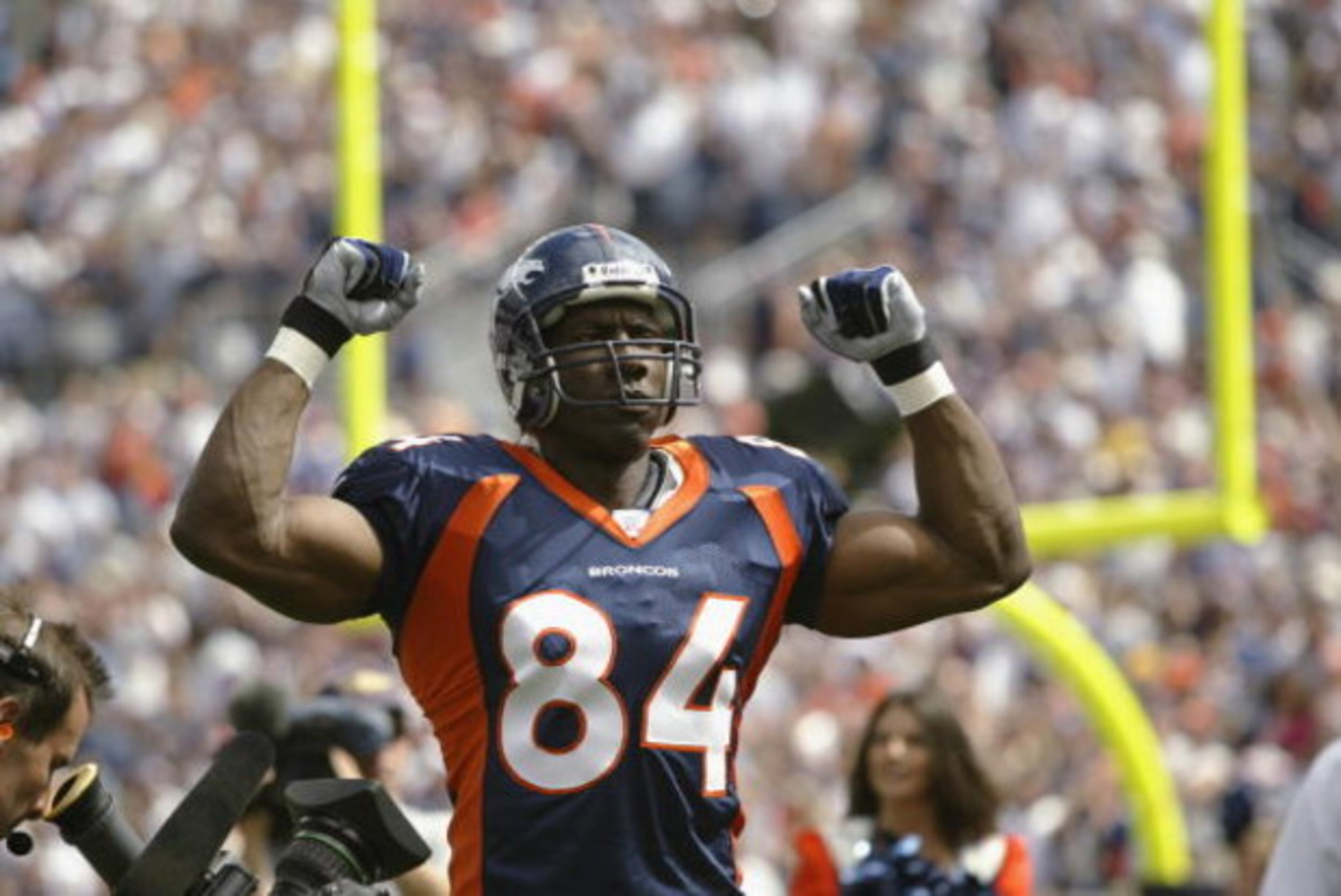 DENVER - SEPTEMBER 8: Tight end Shannon Sharpe #83 of the Denver Broncos pumps his fists in the air as he is introduced to the crowd before the season opener against the St. Louis Rams on September 8, 2002 at Mile High Stadium in Denver, Colorado. (Phot DENVER - SEPTEMBER 8: Tight end Shannon Sharpe #83 of the Denver Broncos pumps his fists in the air as he is introduced to the crowd before the season opener against the St. Louis Rams on September 8, 2002 at Mile High Stadium in Denver, Colorado. (Phot