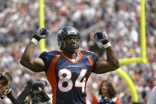 DENVER - SEPTEMBER 8:  Tight end Shannon Sharpe #83 of the Denver Broncos pumps his fists in the air as he is introduced to the crowd before the season opener against the St. Louis Rams on September 8, 2002 at Mile High Stadium in Denver, Colorado.  (Phot