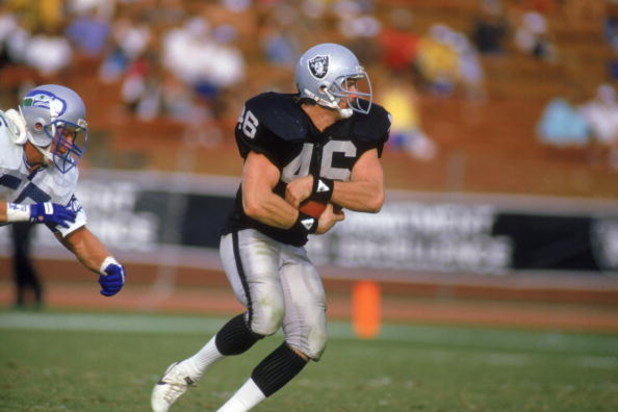 UNDATED: Todd Christensen #46 of the Los Angeles Raiders carries the ball during the game against the Seattle Seahawks at Memorial Coliseum in Los Angeles, California. (Photo by: Stephen Dunn/Getty Images)
