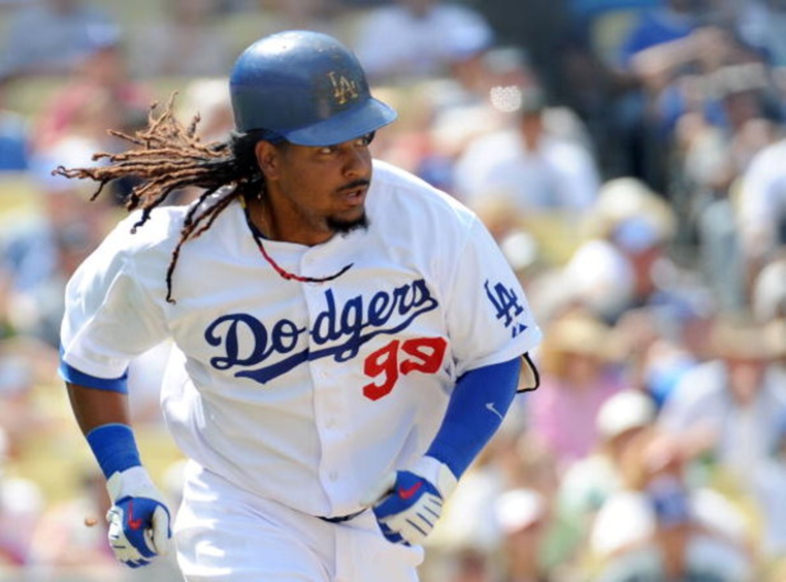 LOS ANGELES, CA - APRIL 19:  Manny Ramirez #99 of the Los Angeles Dodgers runs to first against the Colorado Rockies during the game at Dodger Stadium on April 19, 2009 in Los Angeles, California.  (Photo by Harry How/Getty Images)