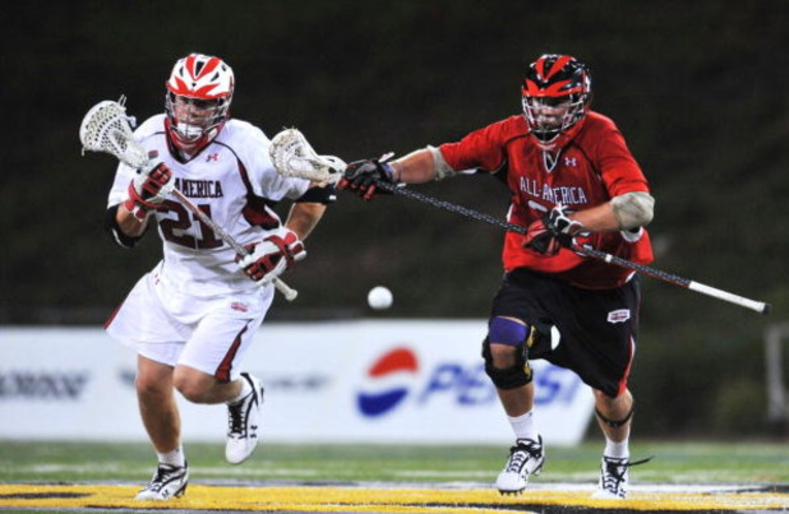 TOWSON, MD-JUNE 27: Chris LaPierre #21 of the Boys All America South team fights for the ball against Tyler Knarr #32 of the Boys All America North team during the Under Armour Lacrosse Classic at Johnny Unitas Stadium on June 27, 2009 in Towson, Maryland