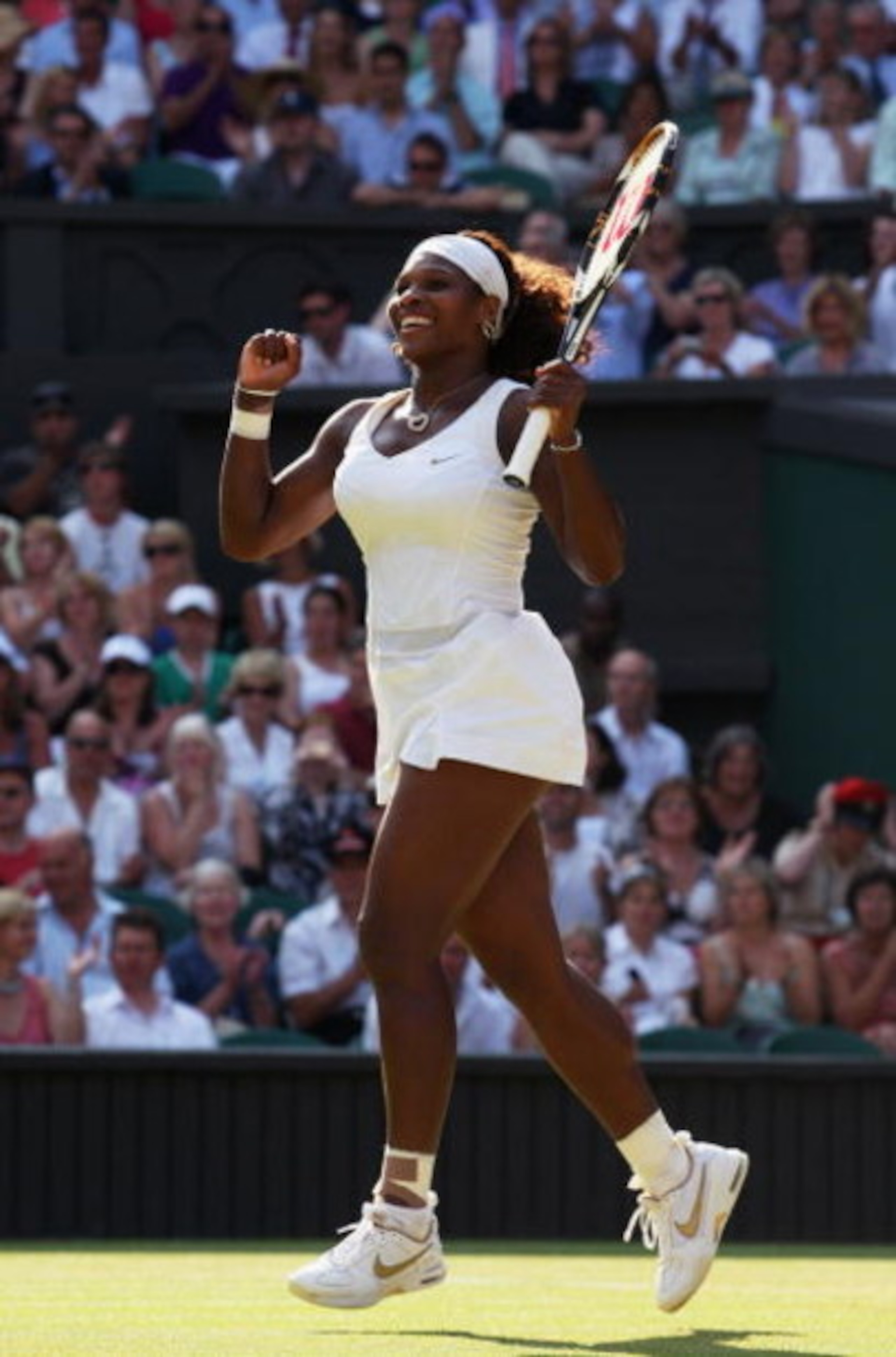 WIMBLEDON, ENGLAND - JUNE 30:  Serena Williams of USA celebrates victory during the women's singles quarter final match against Victoria Azarenka of Belaruson Day Eight of the Wimbledon Lawn Tennis Championships at the All England Lawn Tennis and Croquet 