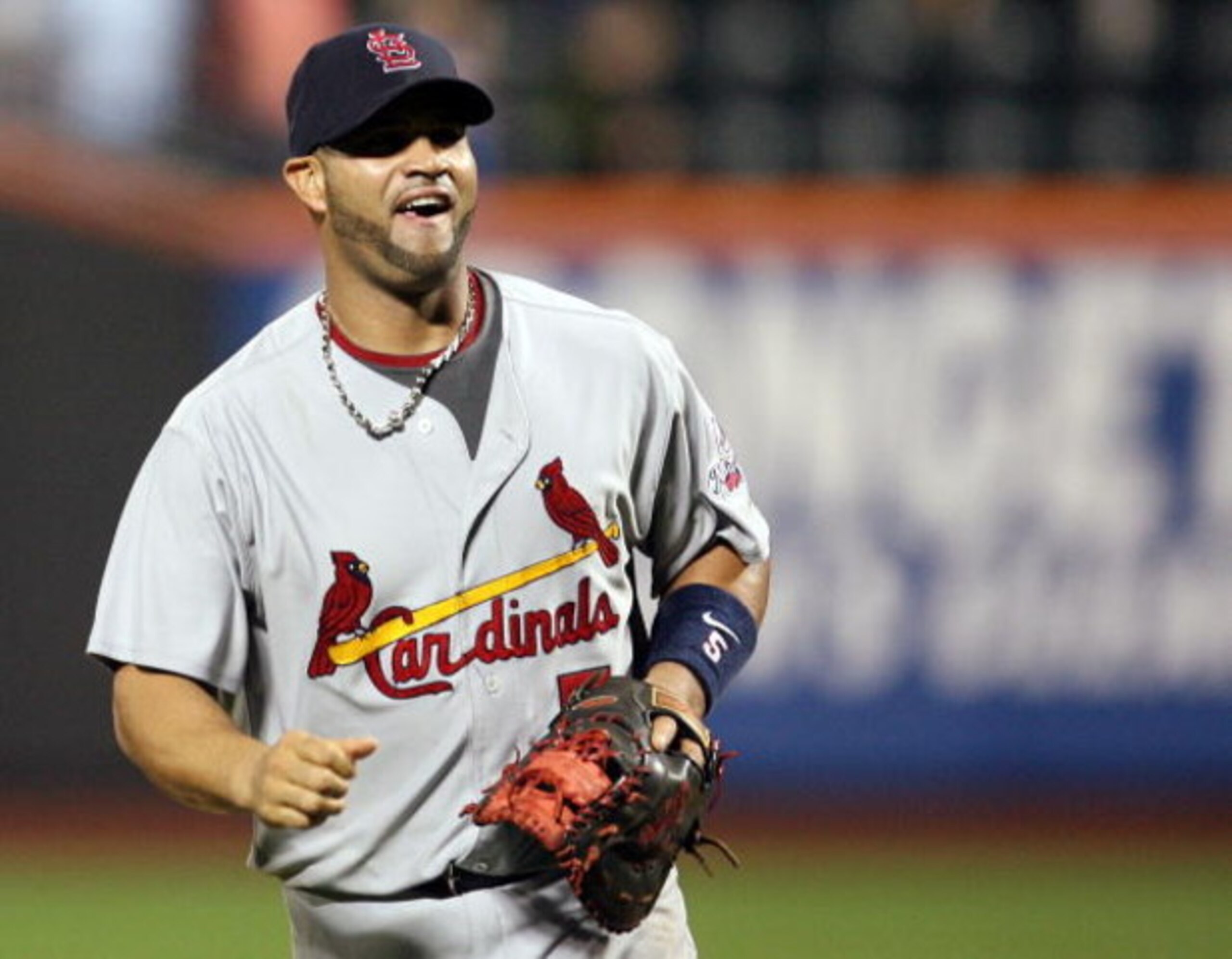NEW YORK - JUNE 23:  Albert Pujols #5 of the St. Louis Cardinals celebrates after defeating the New York Mets at Citi Field on June 23, 2009 in the Flushing neighborhood of the Queens borough of New York City.  (Photo by Michael Heiman/Getty Images)