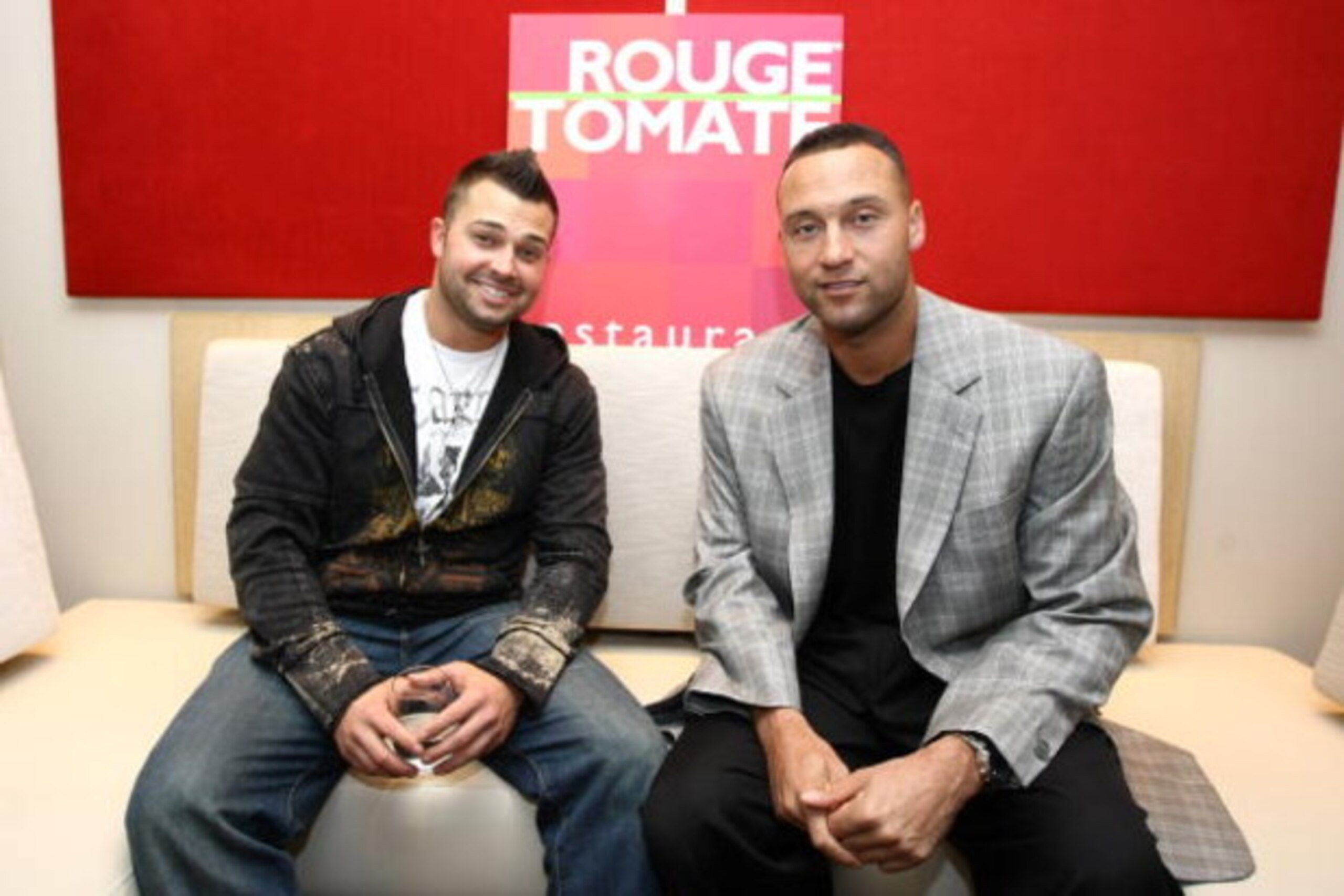 NEW YORK - JUNE 04: *** EXCLUSIVE *** Professional baseball players Nick Swisher (L) and Derek Jeter of the New York Yankees attend a reception hosted by Steiner Sports at Rouge Tomate on June 4, 2009 in New York City. (Photo by Neilson Barnard/Getty Imag