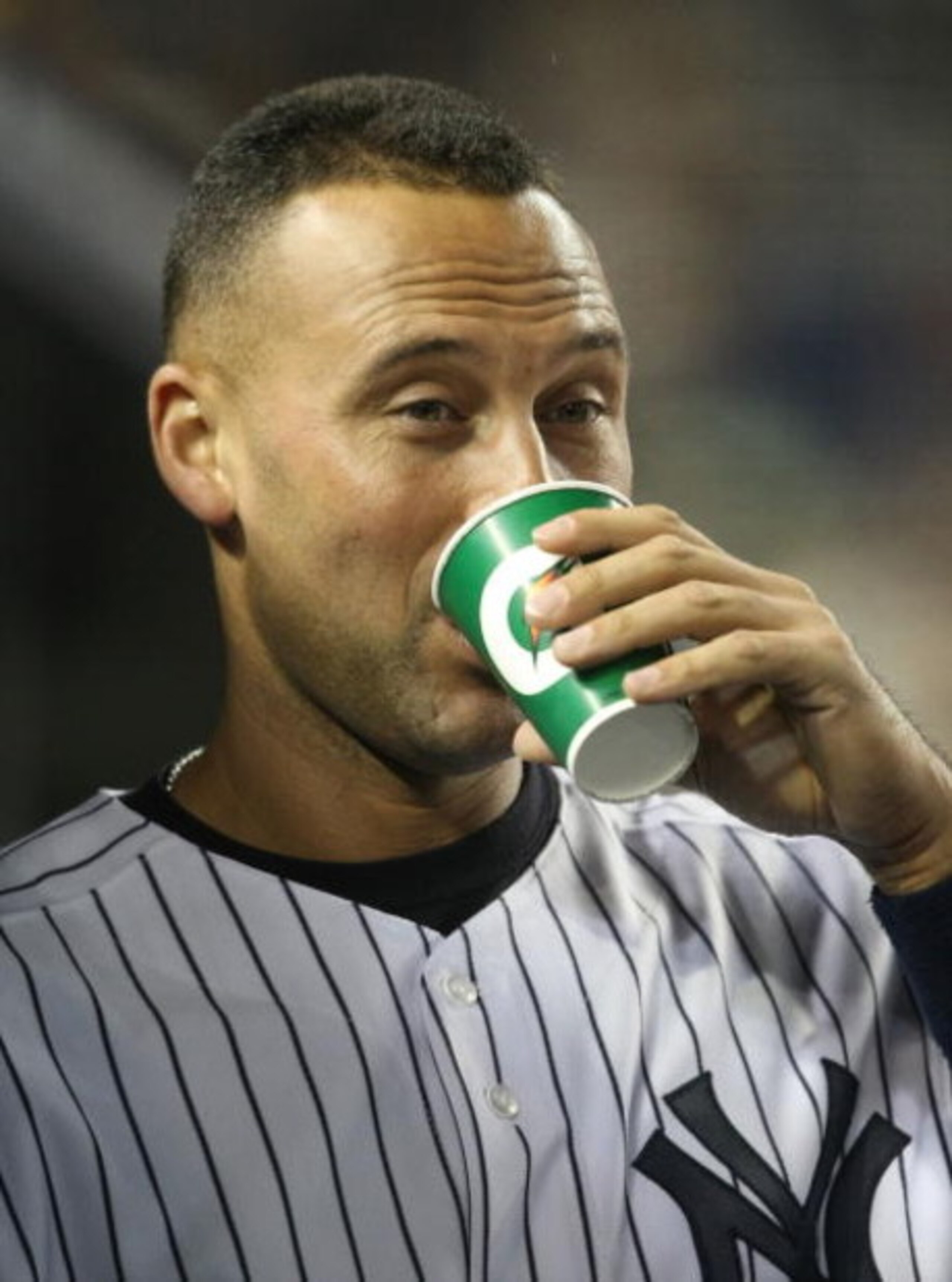 NEW YORK - JUNE 03:  Derek Jeter #2 of the New York Yankees in the dugout against the Texas Rangers on June 3, 2009 at Yankee Stadium in the Bronx borough of New York City.  (Photo by Nick Laham/Getty Images)