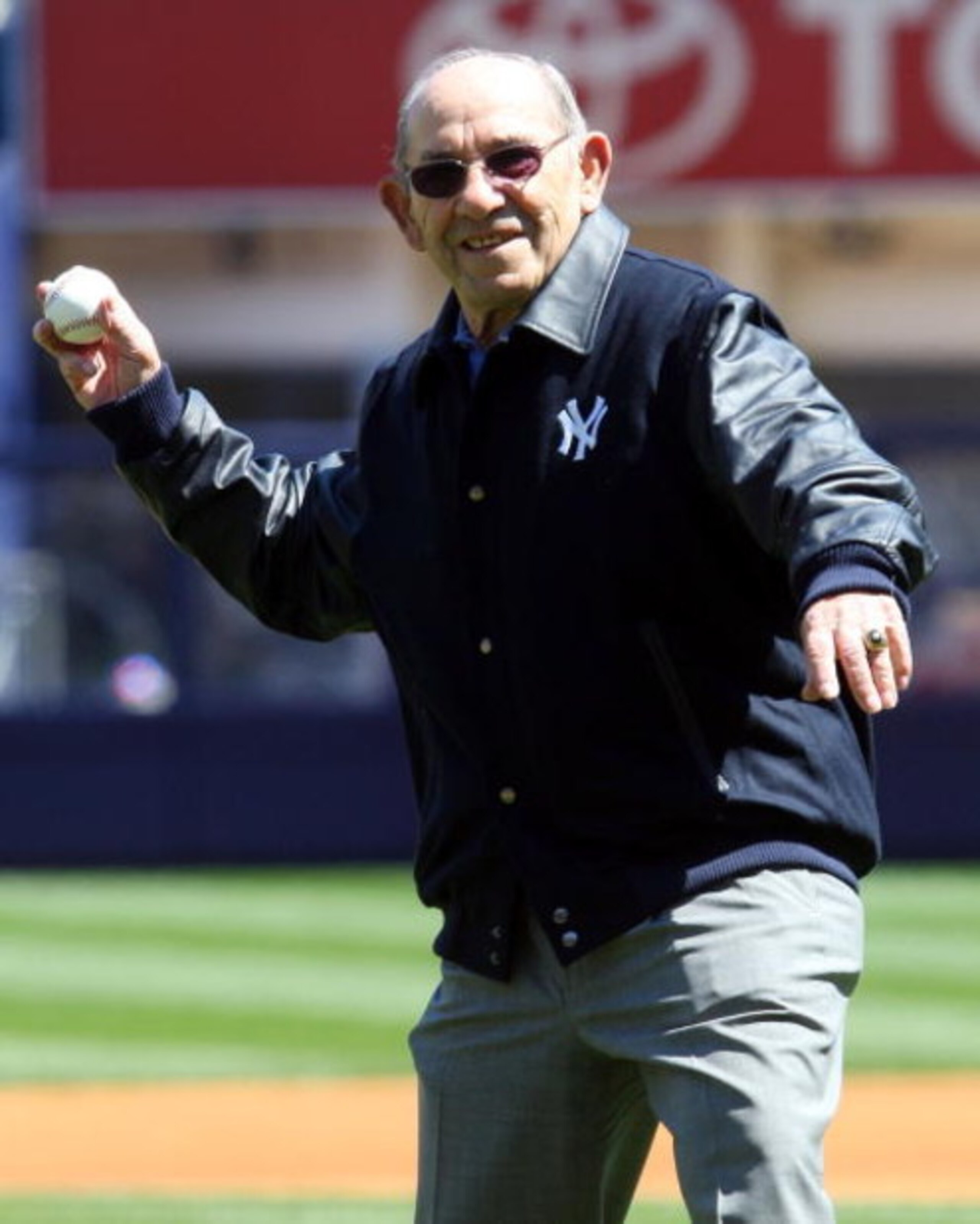 NEW YORK - APRIL 16: Yogi Berra throws the ceremonial first pitch before the opening day game between the Cleveland Indians and the New York Yankees at the new Yankee Stadium on April 16, 2009 in the Bronx borough of New York City. This is the first regul