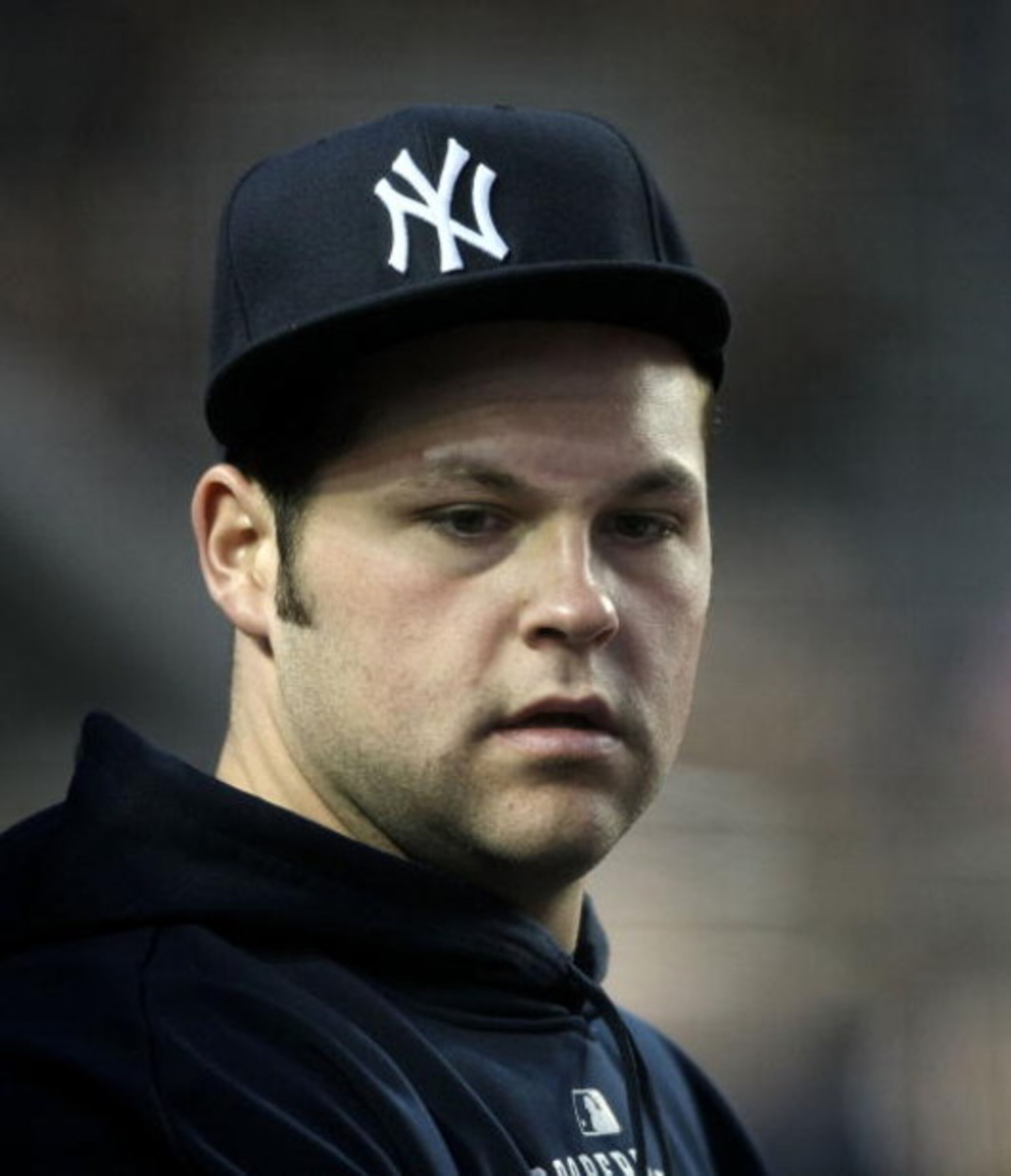 NEW YORK - APRIL 21: Joba Chamberlain #62 of the New York Yankees watches on from the dugout against the Oakland Athletics on April 21, 2009 at Yankee Stadium in the Bronx borough of New York City.  (Photo by Nick Laham/Getty Images)