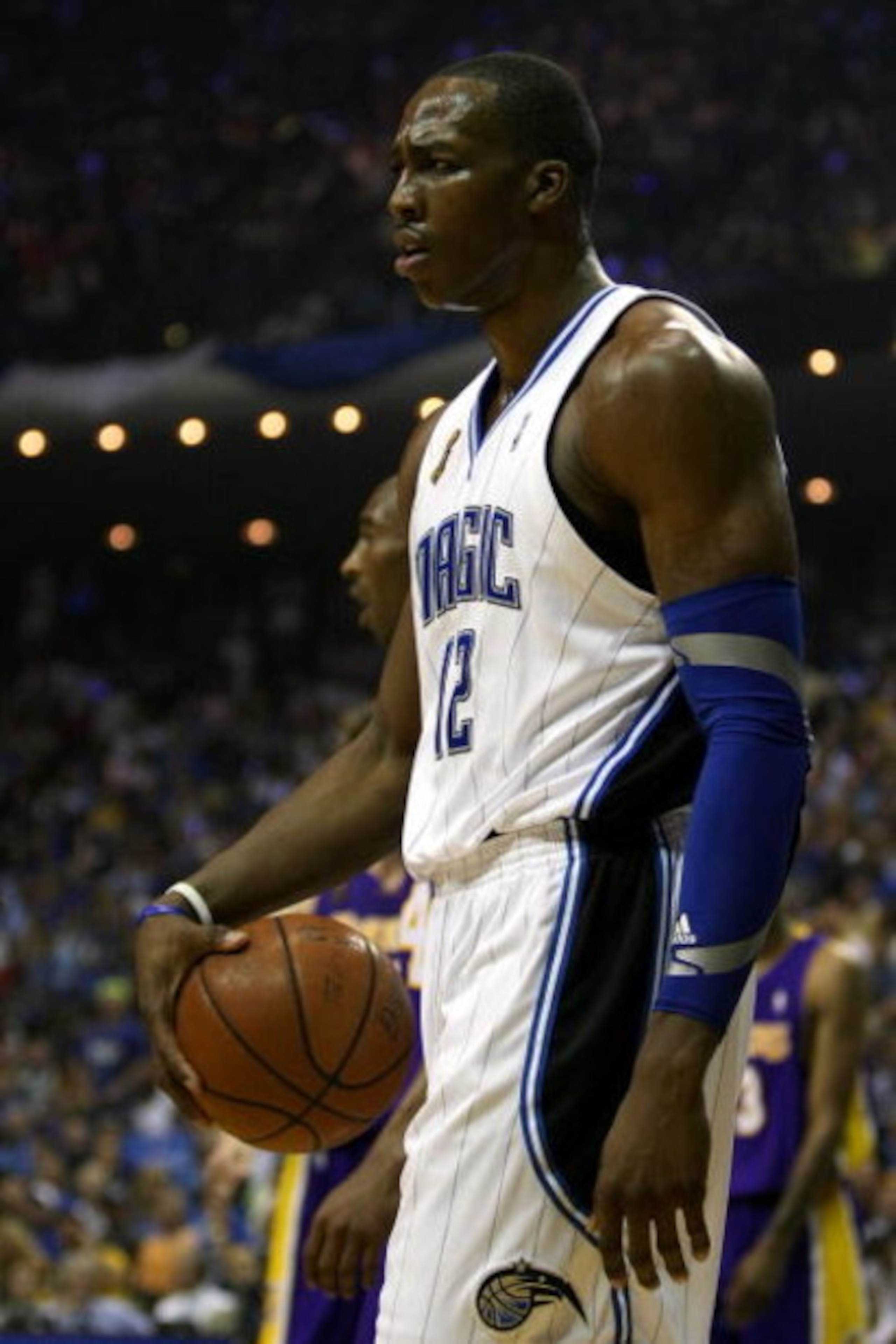 ORLANDO, FL - JUNE 14:  Dwight Howard #12 of the Orlando Magic reacts in the first quarter against the Los Angeles Lakers in Game Five of the 2009 NBA Finals on June 14, 2009 at Amway Arena in Orlando, Florida.  NOTE TO USER:  User expressly acknowledges 