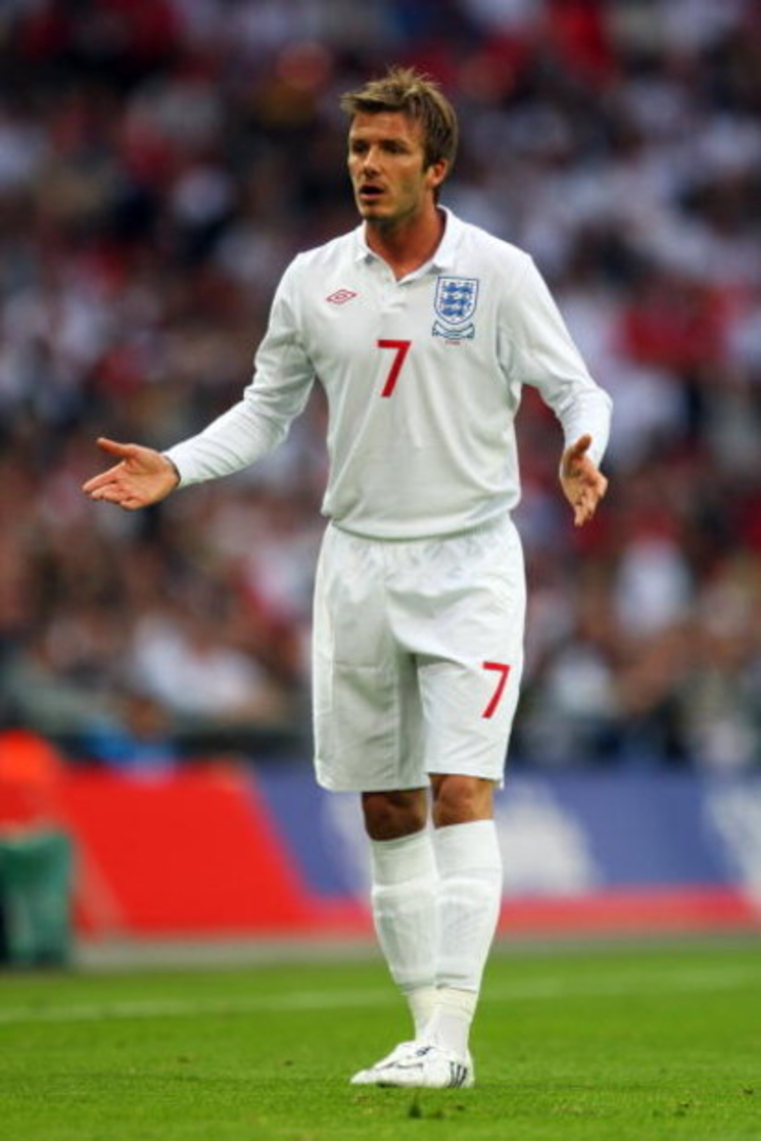 LONDON, ENGLAND - JUNE 10:  David Beckham of England speaks to a team mate during the FIFA 2010 World Cup Group 6 Qualifying match between England and Andorra at Wembley Stadium on June 10, 2009 in London, England.  (Photo by Mark Thompson/Getty Images)