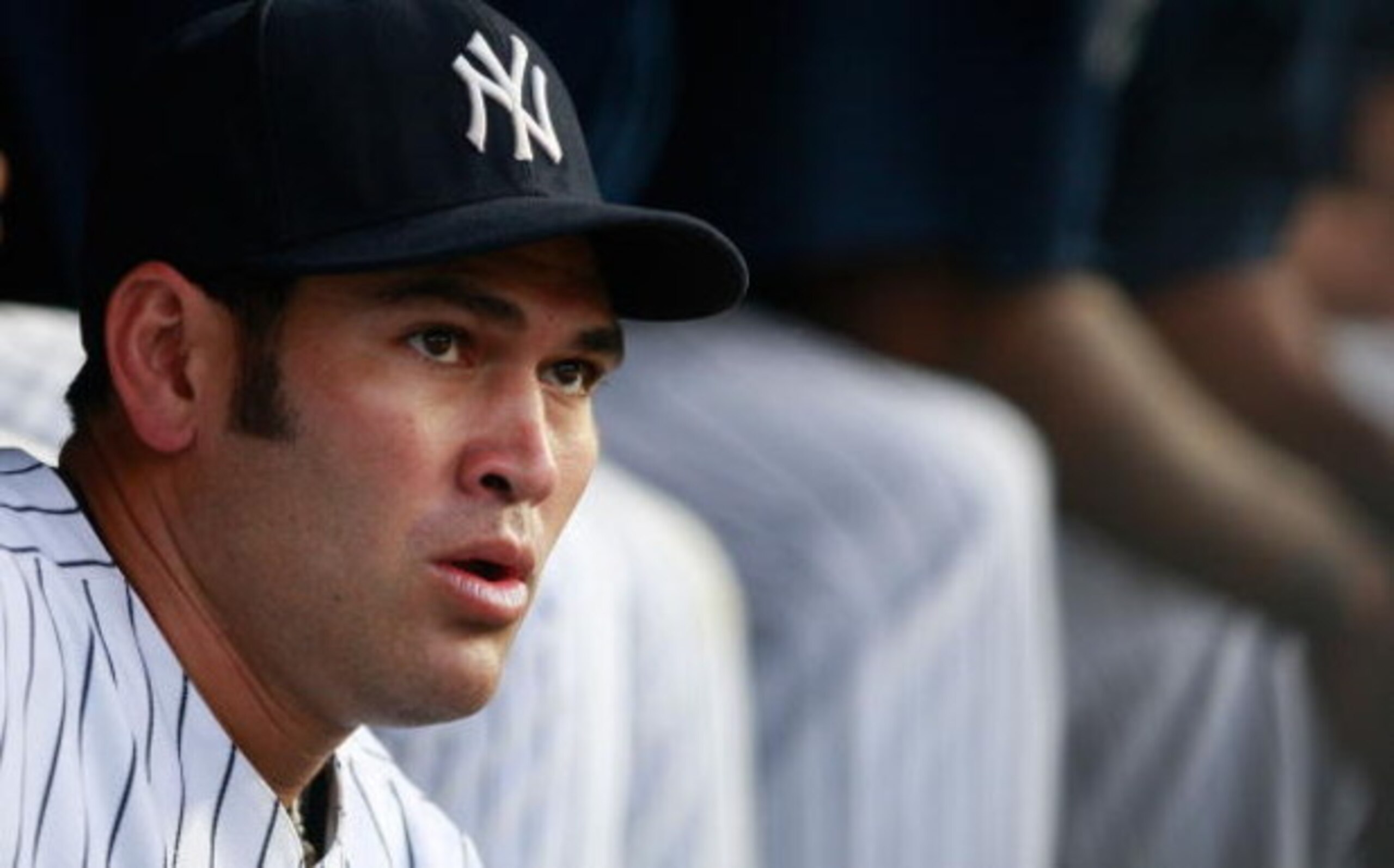 NEW YORK - JUNE 30:  Left fielder Johnny Damon #18 of the New York Yankees sits in the dugout before the game against the Seattle Mariners June 30, 2009 at Yankee Stadium in the Bronx borough of New York City.  (Photo by Mario Tama/Getty Images)