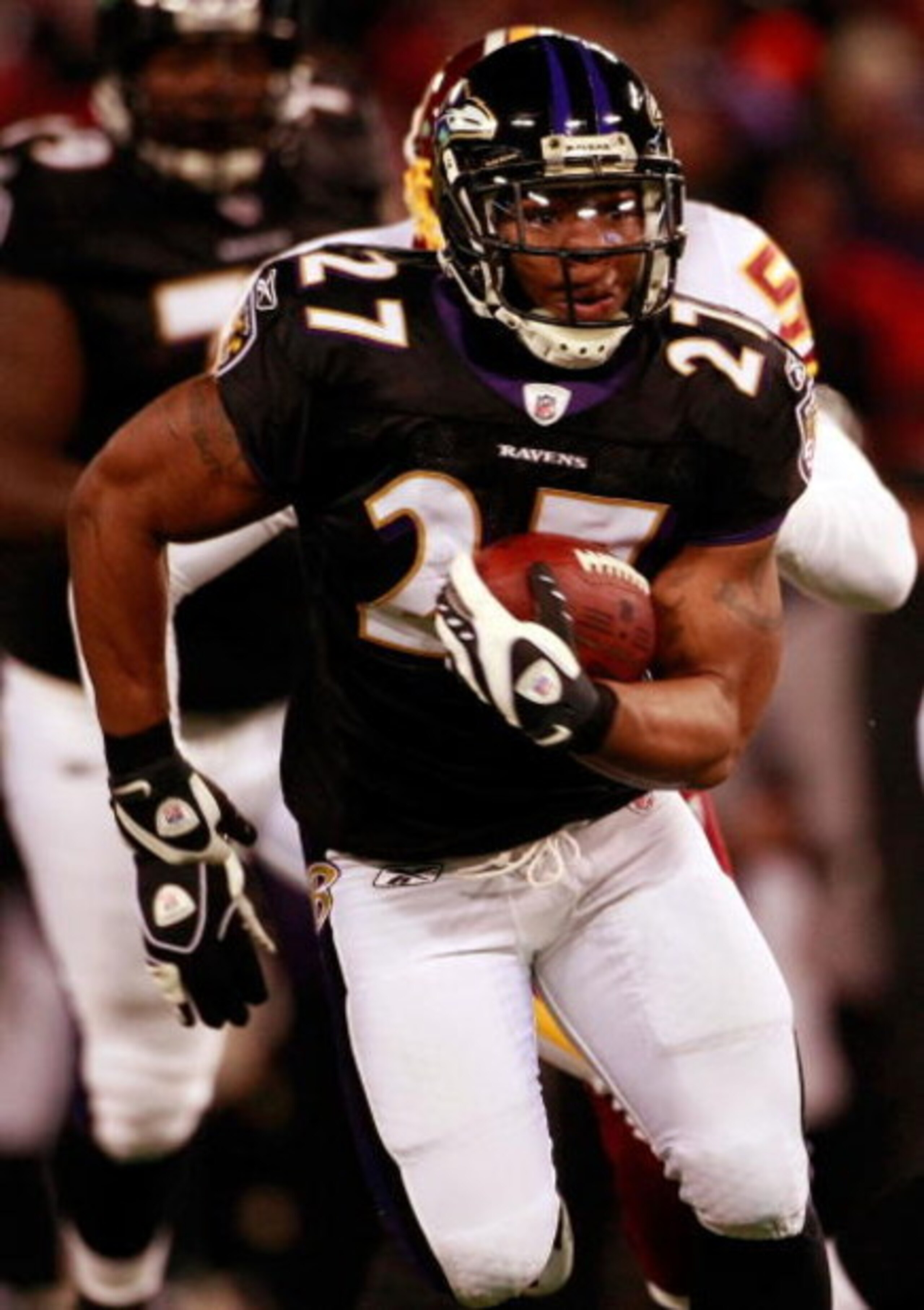 BALTIMORE - DECEMBER 07:  Running back Ray Rice #27 of the Baltimore Ravens eludes Washington runs the ball in first quarter against the Washington Redskins December 7, 2008 at M&T Bank Stadium in Baltimore, Maryland.  (Photo by Win McNamee/Getty Images)