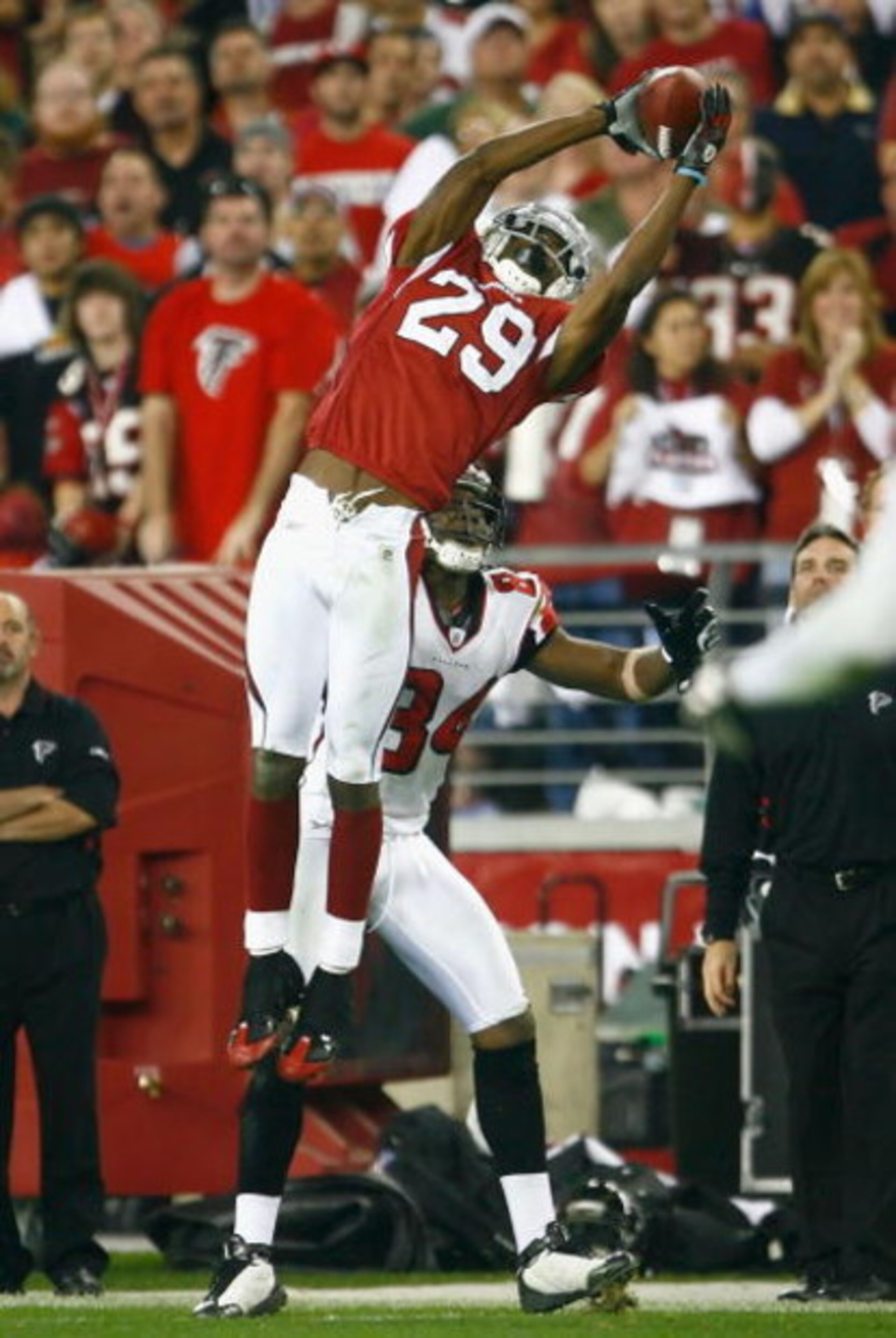 GLENDALE, AZ - JANUARY 03:  Dominique Rodgers-Cromartie #29 of the Arizona Cardinals makes a leaping interception over Roddy White #84 of the Atlanta Falcons during the NFC Wild Card Game on January 3, 2009 at University of Phoenix Stadium in Glendale, Ar