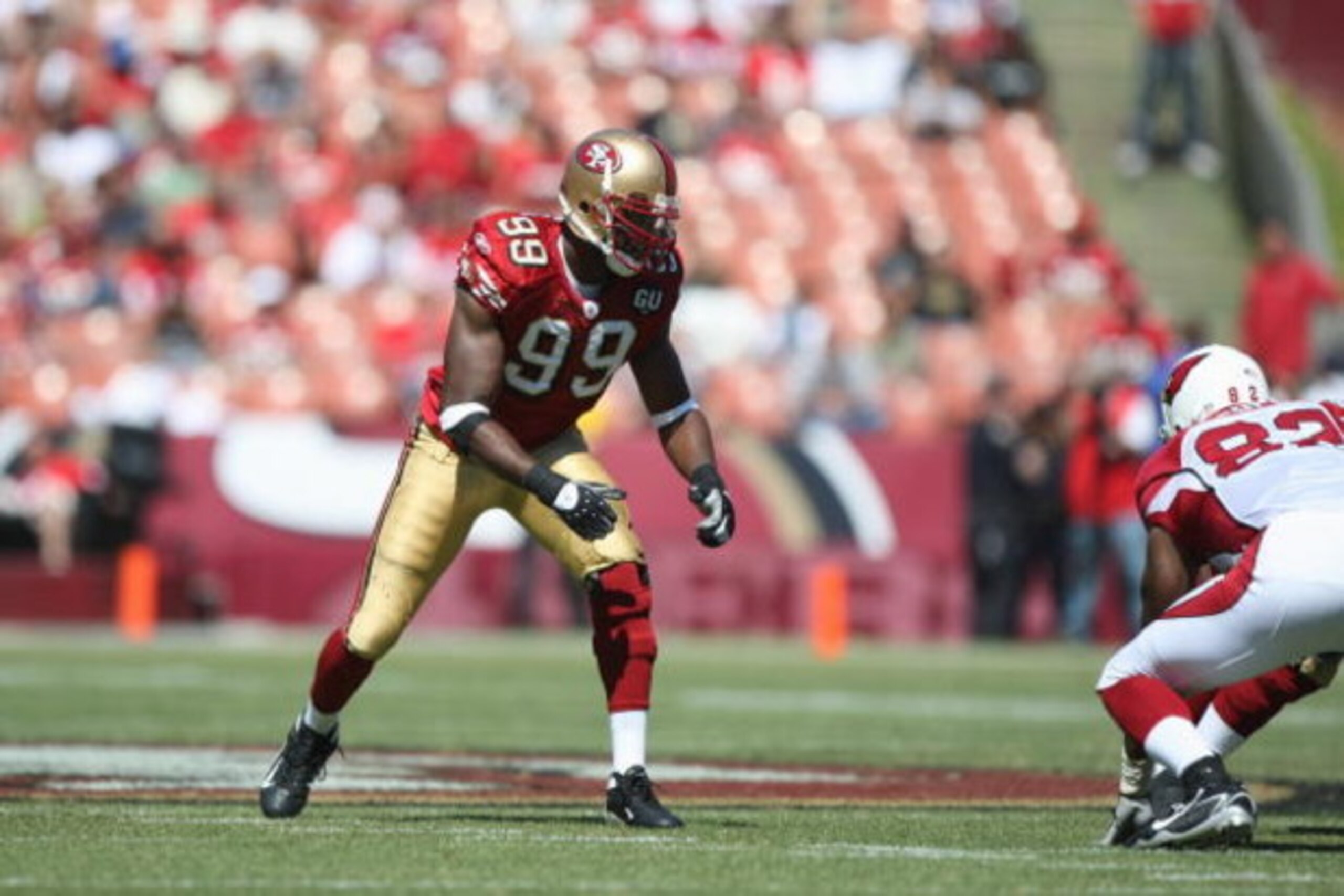 SAN FRANCISCO - SEPTEMBER 7:  Manny Lawson #99 of the San Francisco 49ers lines up during the game against the Arizona Cardinals on September 7, 2008 at Bill Walsh Field at Candlestick Park in San Francisco, California. (Photo by Jed Jacobsohn/Getty Image