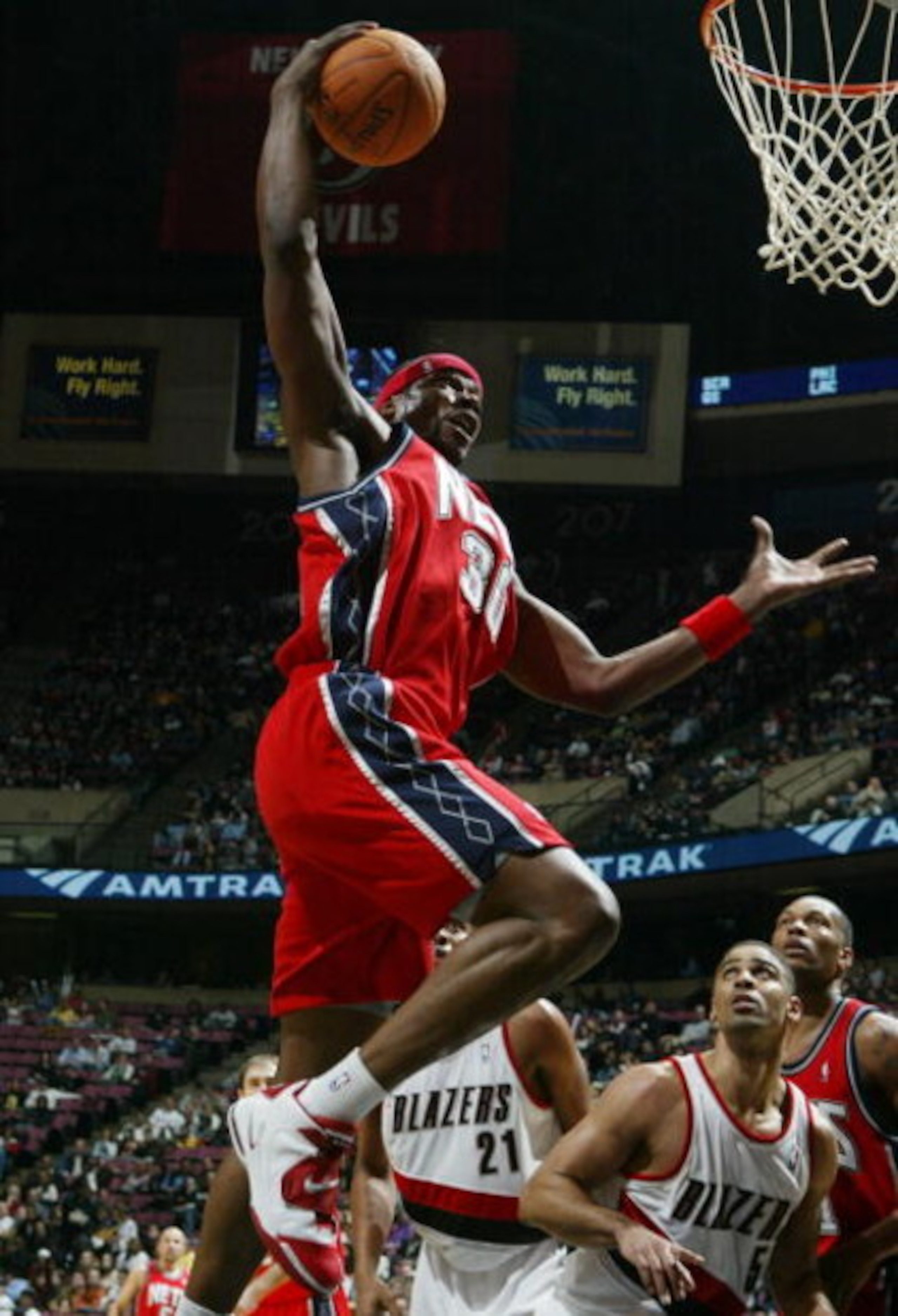 EAST RUTHERFORD, NJ - NOVEMBER 18: Clifford Robinson #30 of the New Jersey Nets grabs a rebound against the Portland Trail Blazers during their game on November 18, 2006 at Continental Airlines Arena in East Rutherford, New Jersey. NOTE TO USER: User expr