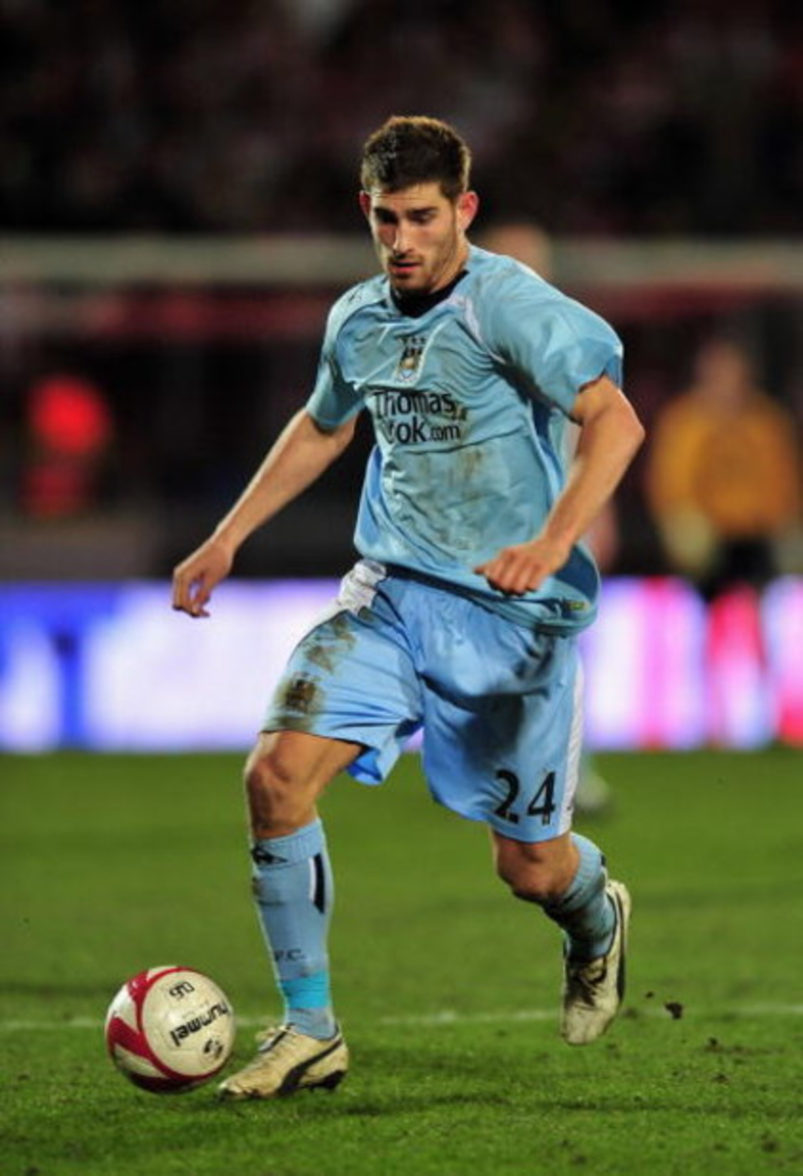 AALBORG, DENMARK - MARCH 19:  Ched Evans of Manchester City runs with the ball during the UEFA Cup, Round of 16, Second Leg match between Aalborg and Manchester City on March 19, 2009 in Aalborg, Denmark.  (Photo by Stuart Franklin/Getty Images)