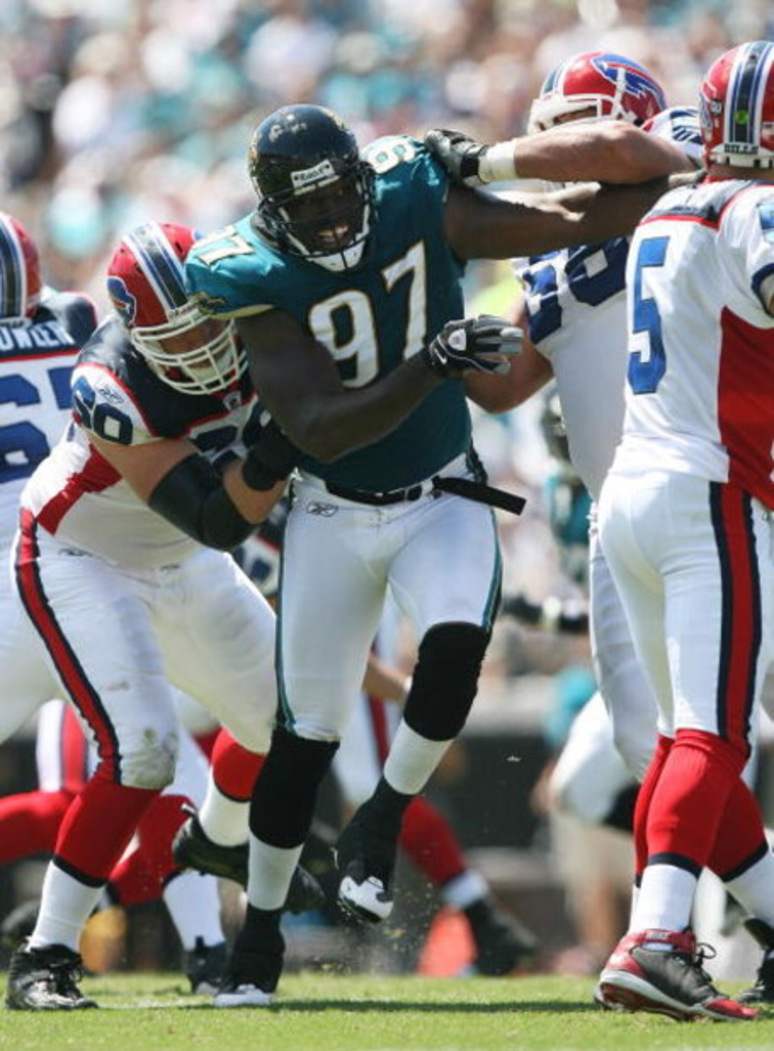 JACKSONVILLE, FL - SEPTEMBER 14:  Defensive end Reggie Hayward #97 of the Jacksonville Jaguars tries to get to get to quarterback Trent Edwards #5 of the Buffalo Bills at Jacksonville Municipal Stadium on September 14, 2008 in Jacksonville, Florida. The B