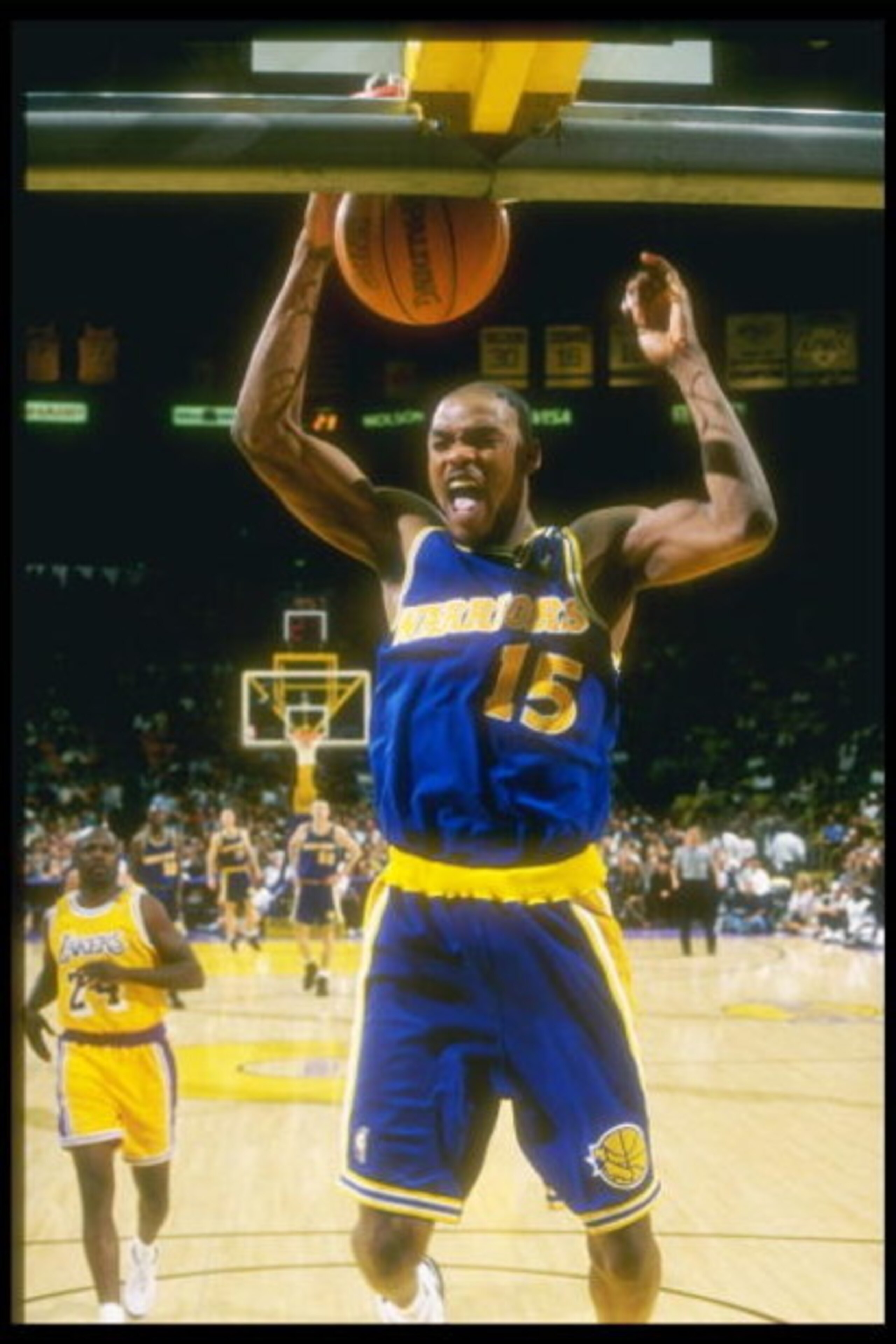 12 Mar 1997: Guard Latrell Sprewell of the Golden State Warriors slam dunks the ball during a game against the Los Angeles Lakers at the Great Western Forum in Inglewood, California. The Lakers won the game 109 - 101.
