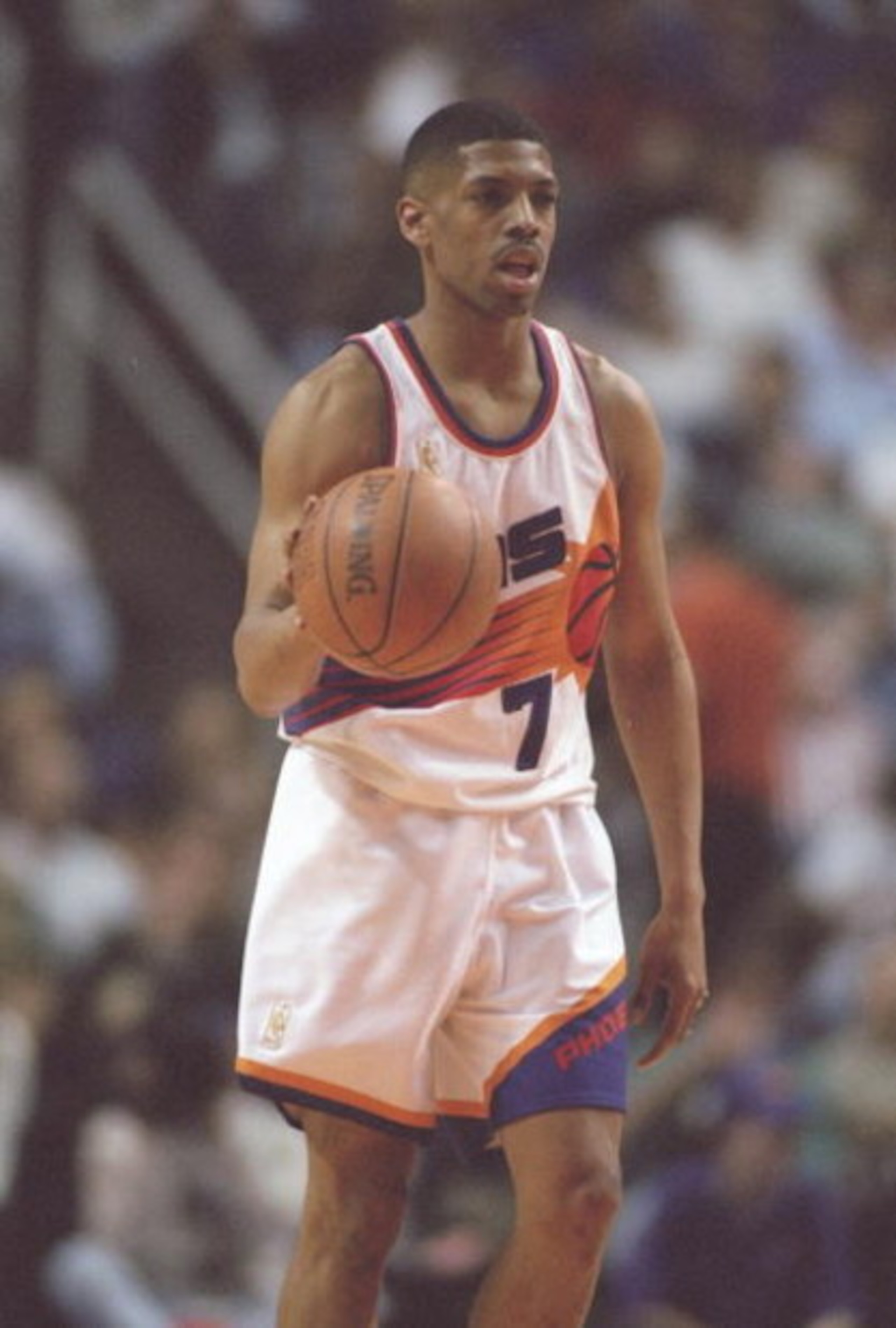 14 Feb 1997: Guard Kevin Johnson of the Phoenix Suns dribbles the ball down the court during a game against the Los Angeles Clippers at the America West Arena in Phoenix, Arizona. The Suns won the game 110-93.