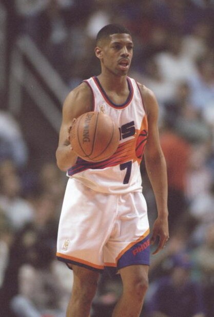 14 Feb 1997: Guard Kevin Johnson of the Phoenix Suns dribbles the ball down the court during a game against the Los Angeles Clippers at the America West Arena in Phoenix, Arizona. The Suns won the game 110-93.