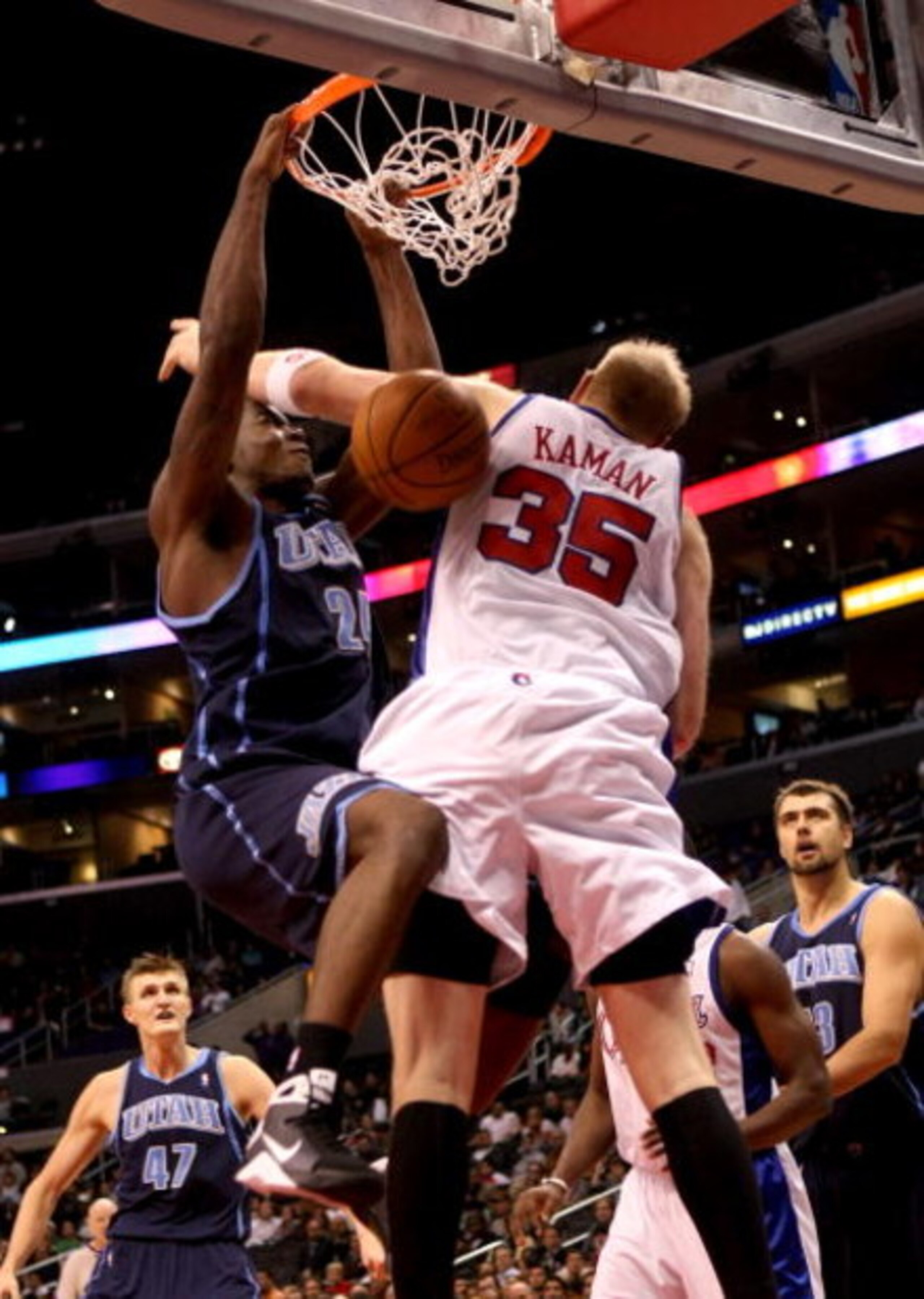 LOS ANGELES, CA - NOVEMBER 03:  Paul Millsap #24 of the Utah Jazz dunks over Chris Kaman #35 of the Los Angeles Clippers on November 3, 2008 at Staples Center in Los Angeles, California. The Jazz won 89-73.  NOTE TO USER: User expressly acknowledges and a