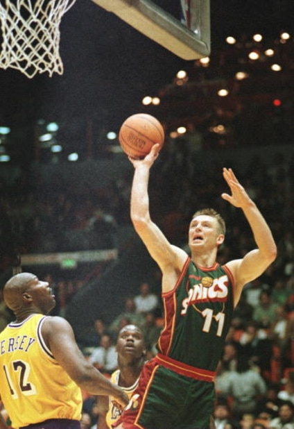 3 Dec 1996:  Detlef Schrempf #11 of the Seattle Supersonics goes up for a shot while Los Angeles Lakers forward Jerome Kersey #12 looks on during the first quarter at the Great Western Forum in Inglewood, California.  Mandatory Credit: Stephen Dunn/Allspo