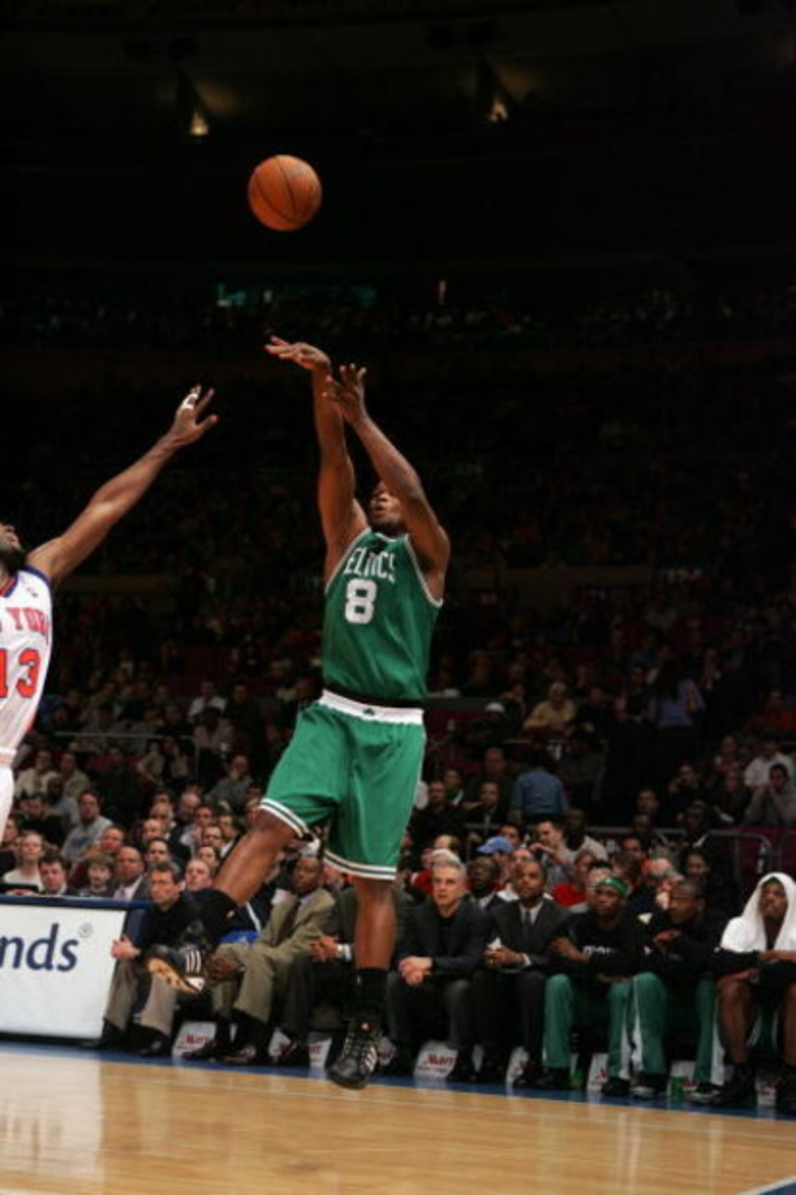 NEW YORK - MARCH 23:  Antoine Walker #8 of the Boston Celtics shoots over Malik Rose #13 of the New York Knicks during the game on March 23, 2005 at Madison Square Garden in New York City.  The Knicks won 107-82.  NOTE TO USER:  User expressly acknowledge