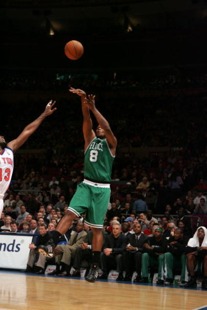 NEW YORK - MARCH 23:  Antoine Walker #8 of the Boston Celtics shoots over Malik Rose #13 of the New York Knicks during the game on March 23, 2005 at Madison Square Garden in New York City.  The Knicks won 107-82.  NOTE TO USER:  User expressly acknowledge