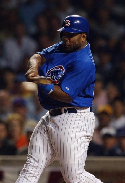 CHICAGO - OCTOBER 7:  First baseman Randall Simon #35 of the Chicago Cubs swings during game one of the National League Championship Series against the Florida Marlins on October 7, 2003 at Wrigley Field in Chicago, Illinois. The Marlins won 9-8. (Photo b