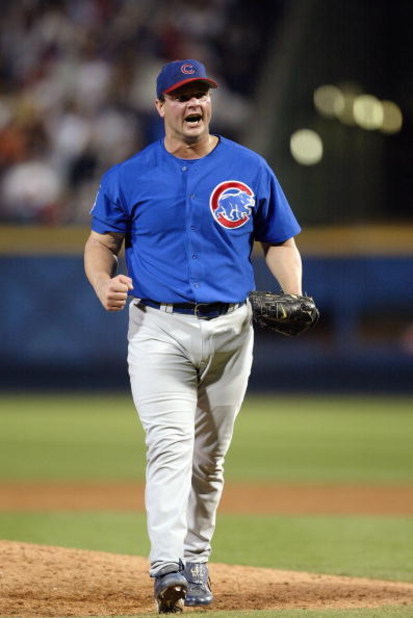 ATLANTA - OCTOBER 5:  Closer Joe Borowski #48 of the Chicago Cubs pumps his fist after the victory over the Atlanta Braves in game five of their National League Division Series on October 5, 2003 at Turner Field in Atlanta, Georgia.  The Cubs defeated the