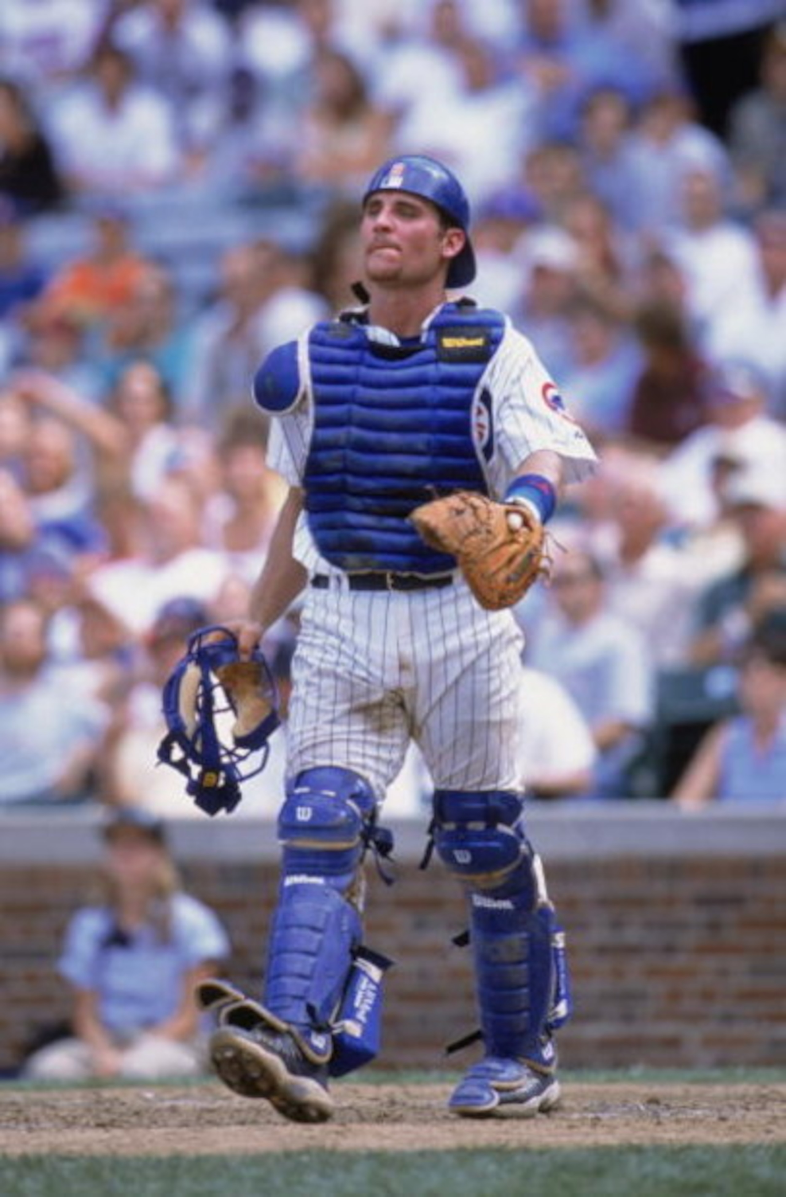CHICAGO - AUGUST 11:  Todd Hundley #9 of the Chicago Cubs walks on the field during their game against the Houston Astros at Wrigley Field in Chicago, Illinois on August 11, 2002. Cubs defeated the Astros 6-4. (Photo by:  Jonathan Daniel/Getty Images)