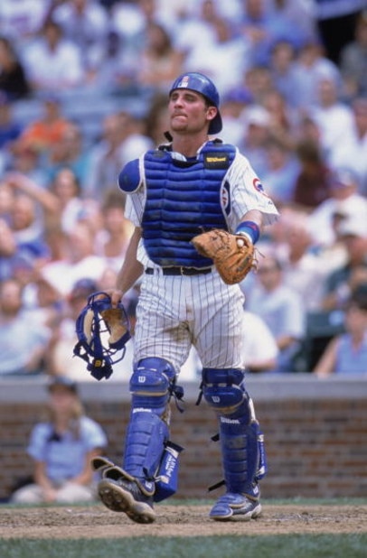 CHICAGO - AUGUST 11:  Todd Hundley #9 of the Chicago Cubs walks on the field during their game against the Houston Astros at Wrigley Field in Chicago, Illinois on August 11, 2002. Cubs defeated the Astros 6-4. (Photo by:  Jonathan Daniel/Getty Images)