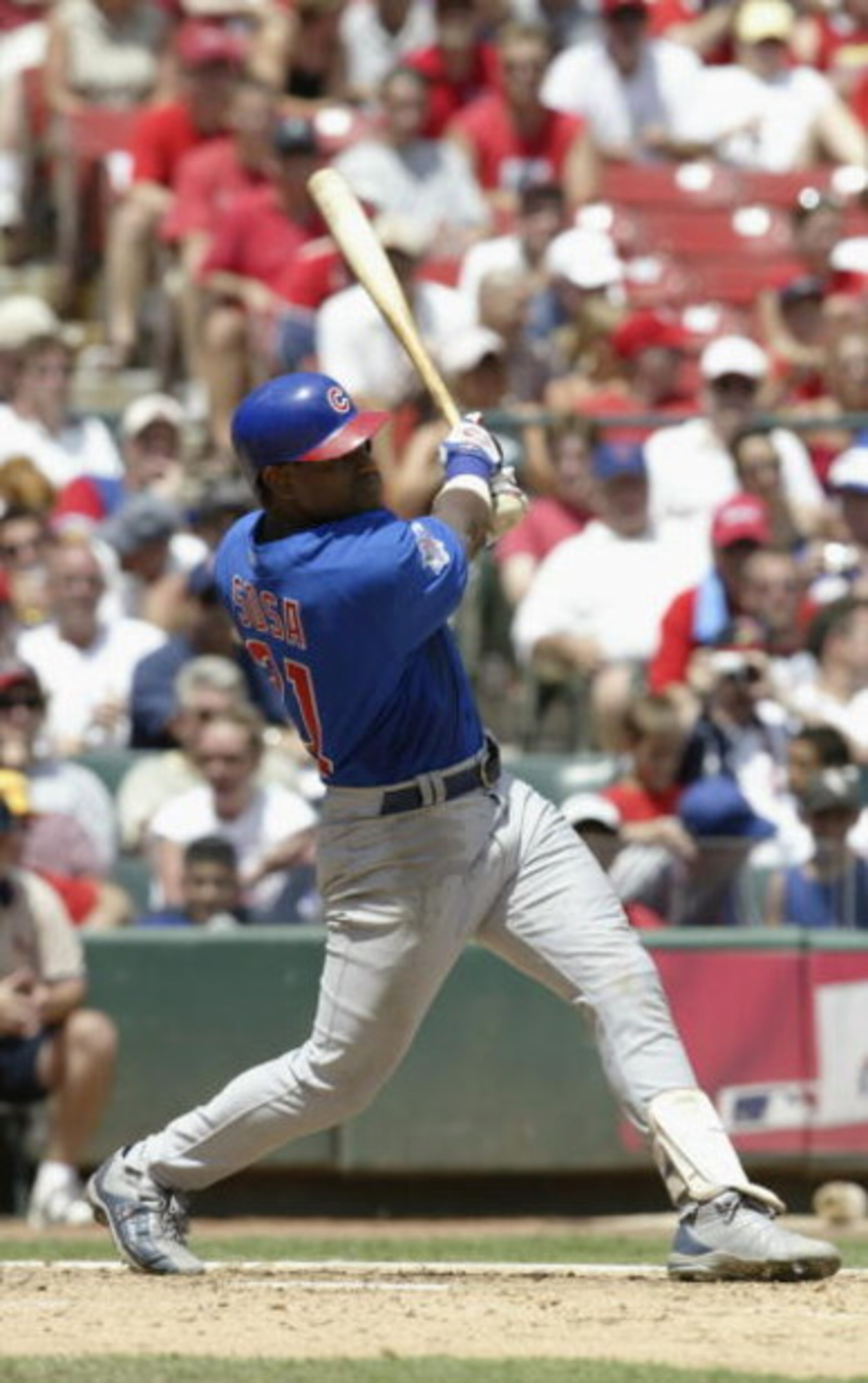 ST. LOUIS - JULY 10:  Sammy Sosa #21 of the Chicago Cubs swings at the pitch during the game against the St. Louis Cardinals on July 10, 2004 at Busch Stadium in St. Louis, Missouri.  The Cardinals won 5-2.  (Photo by Elsa/Getty Images) 