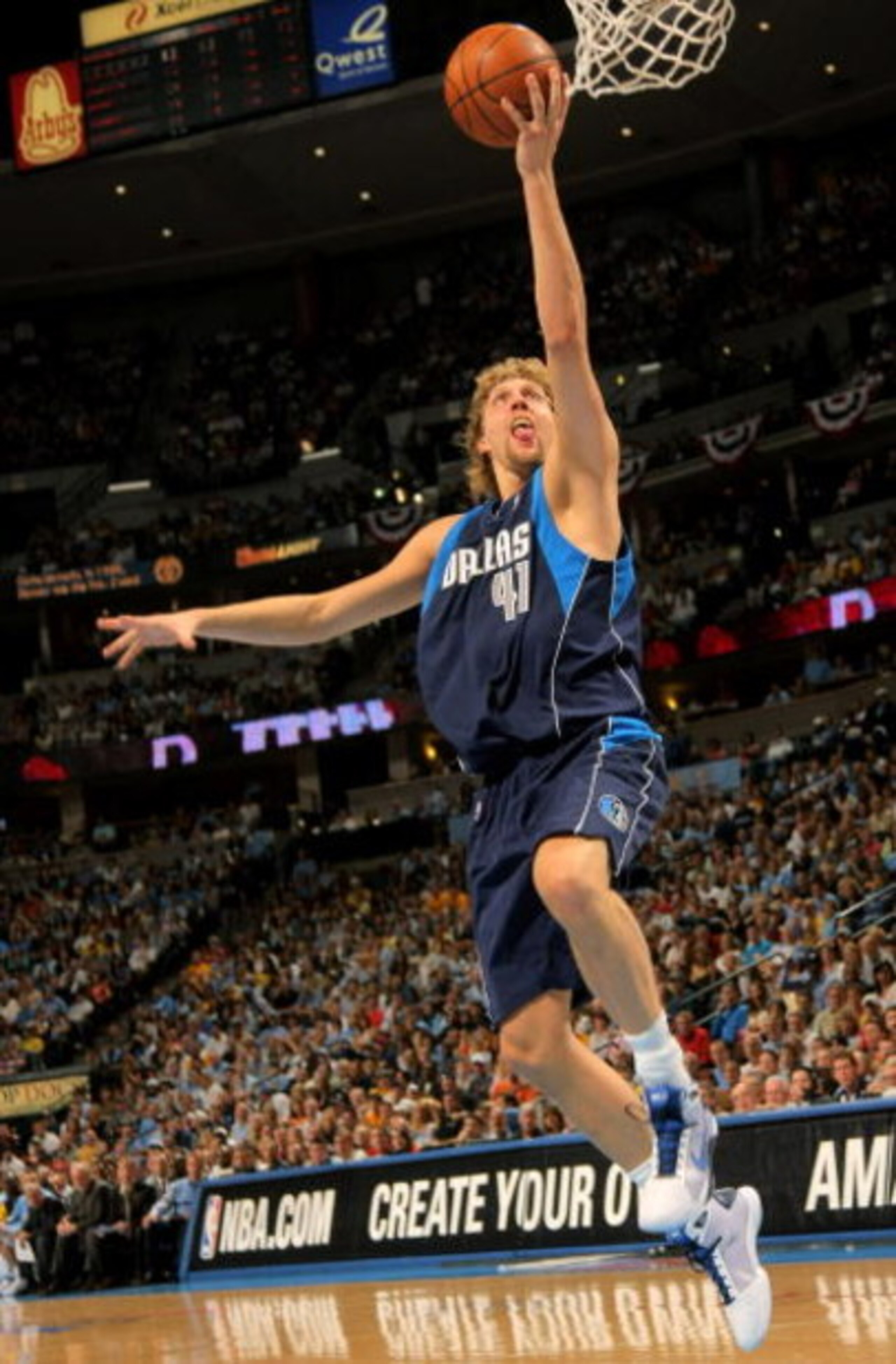 DENVER - MAY 03:  Dirk Nowitzki #41 of the Dallas Mavericks lays up a shot against the Denver Nuggets in Game One of the Western Conference Semifinals during the 2009 NBA Playoffs at Pepsi Center on May 3, 2009 in Denver, Colorado. NOTE TO USER: User expr