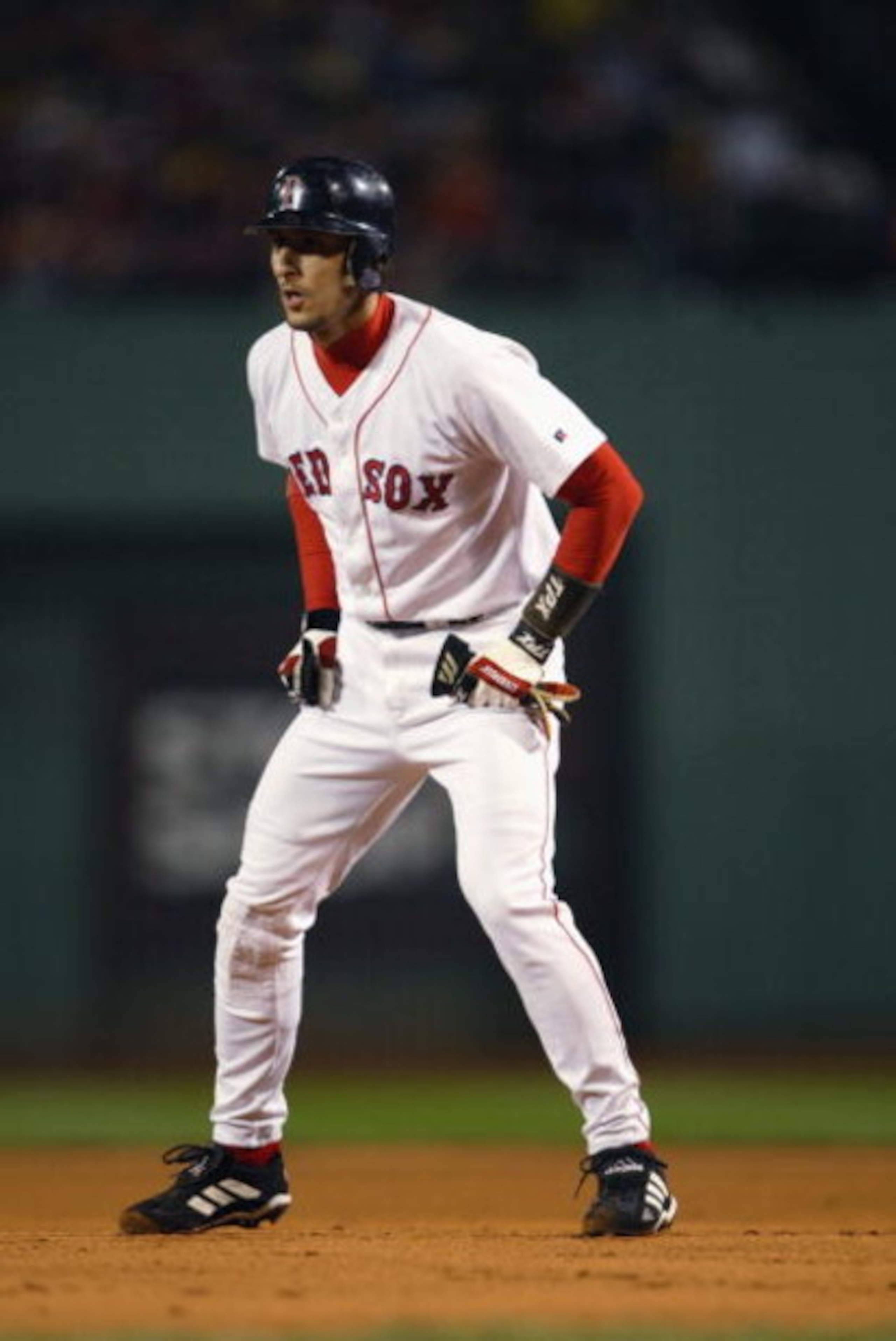 BOSTON - OCTOBER 4:  Shortstop Nomar Garciaparra #5 of the Boston Red Sox leads off a base against the Oakland Athletics during game three of the American League Division Series at Fenway Park on October 4, 2003 in Boston, Massachusetts.  The Red Sox defe