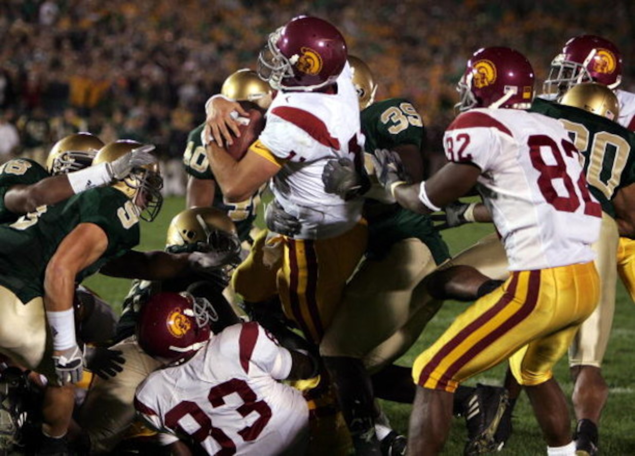 SOUTH BEND, IN - OCTOBER 15:  Quarterback Matt Leinart #11 of the University of Southern California Trojans rolls into the end zone with the winning touchdown against the Notre Dame Fighting Irish on October 15, 2005 at Notre Dame Stadium in South Bend, I