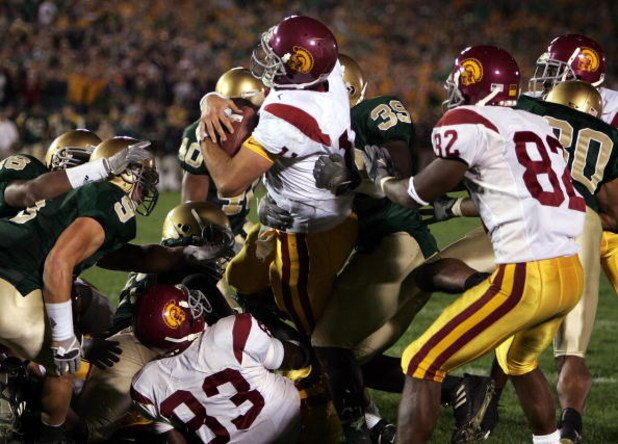 SOUTH BEND, IN - OCTOBER 15:  Quarterback Matt Leinart #11 of the University of Southern California Trojans rolls into the end zone with the winning touchdown against the Notre Dame Fighting Irish on October 15, 2005 at Notre Dame Stadium in South Bend, I