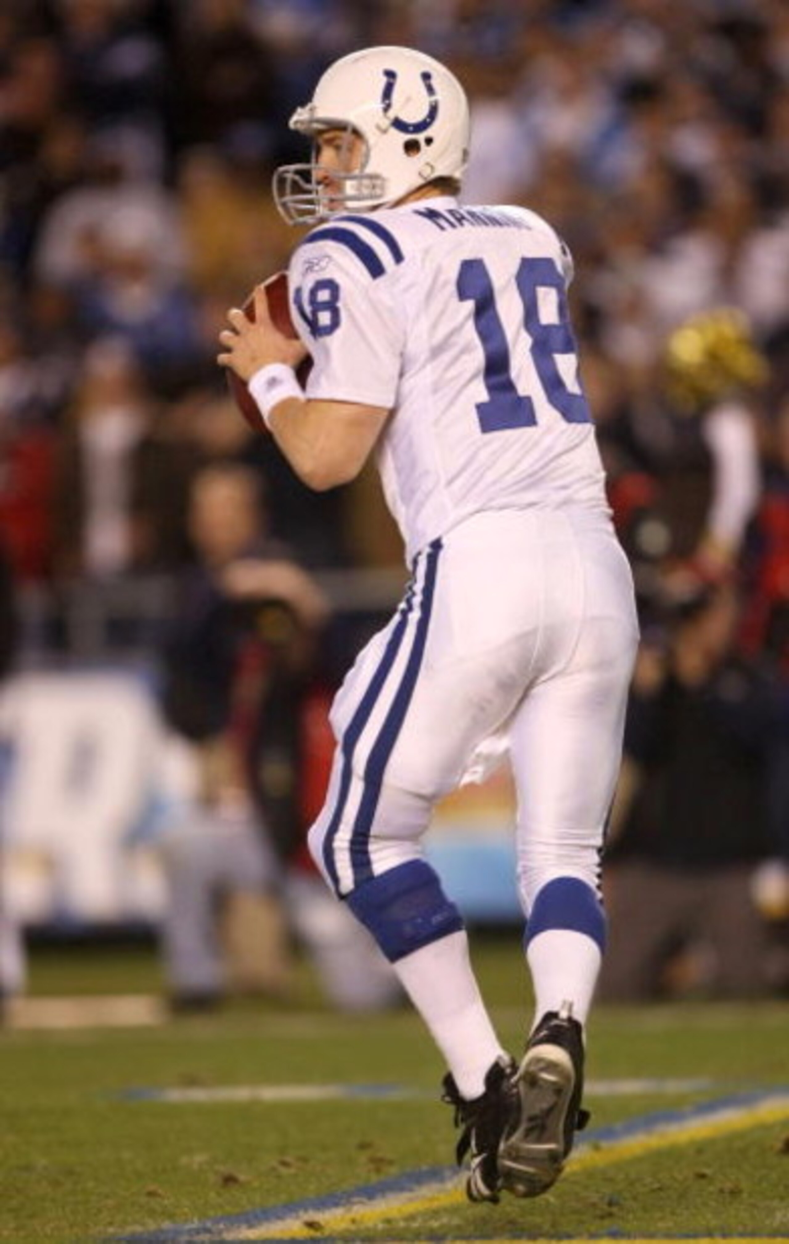 SAN DIEGO - JANUARY 03:  Quarterback Peyton Manning #18 of the Indianapolis Colts drops back to pass during the AFC Wild Card Game against the San Diego Chargers on January 3, 2009 at Qualcomm Stadium in San Diego, California.  (Photo by Stephen Dunn/Gett