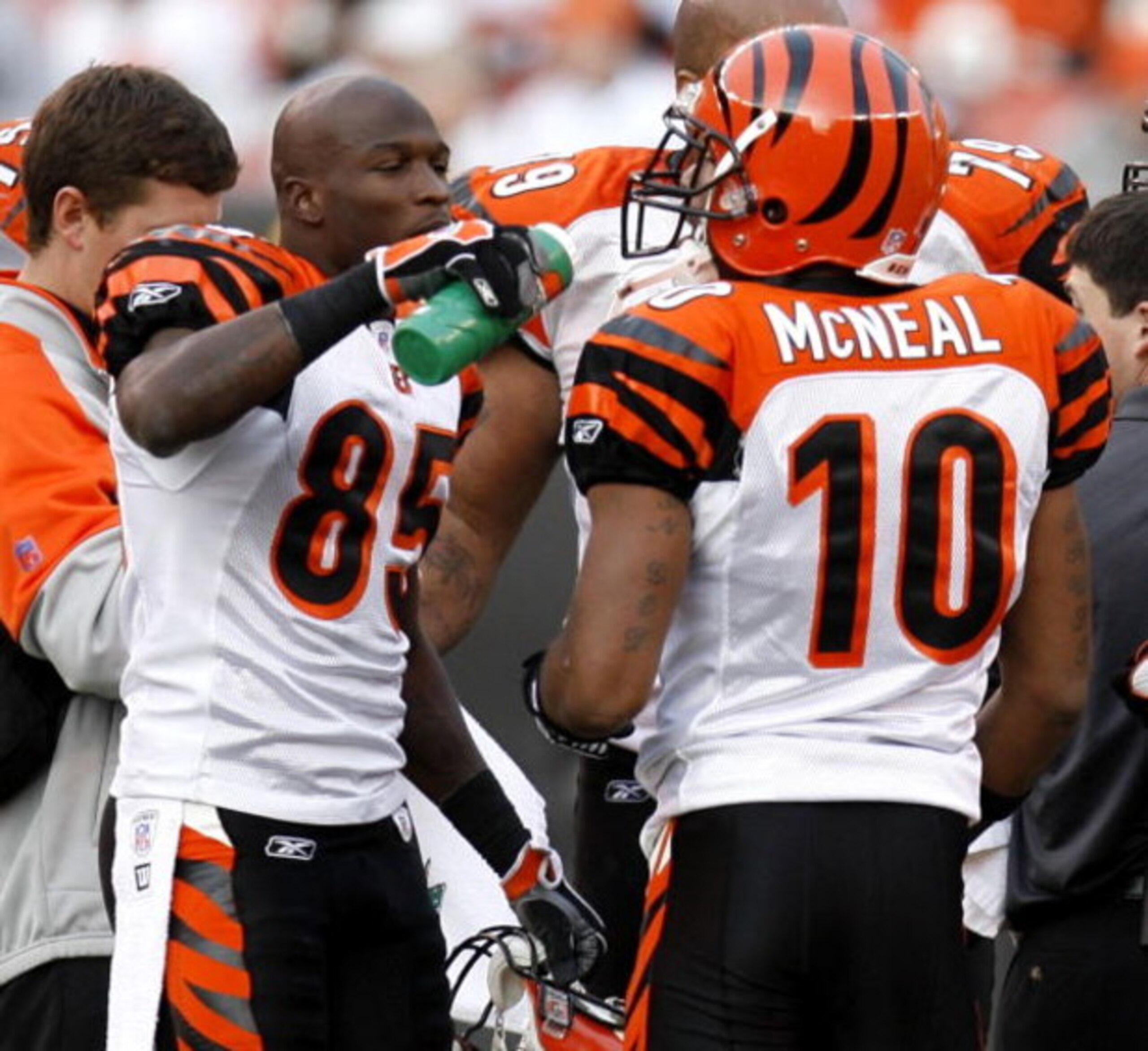 CLEVELAND - NOVEMBER 26:  Chad Johnson #85 of the Cincinnati Bengals gives a drink of water to Reggie McNeal #10 during a fourth quarter timeout after the Cincinatti starters had left the game against Cleveland Browns on November 26, 2006 at Cleveland Bro