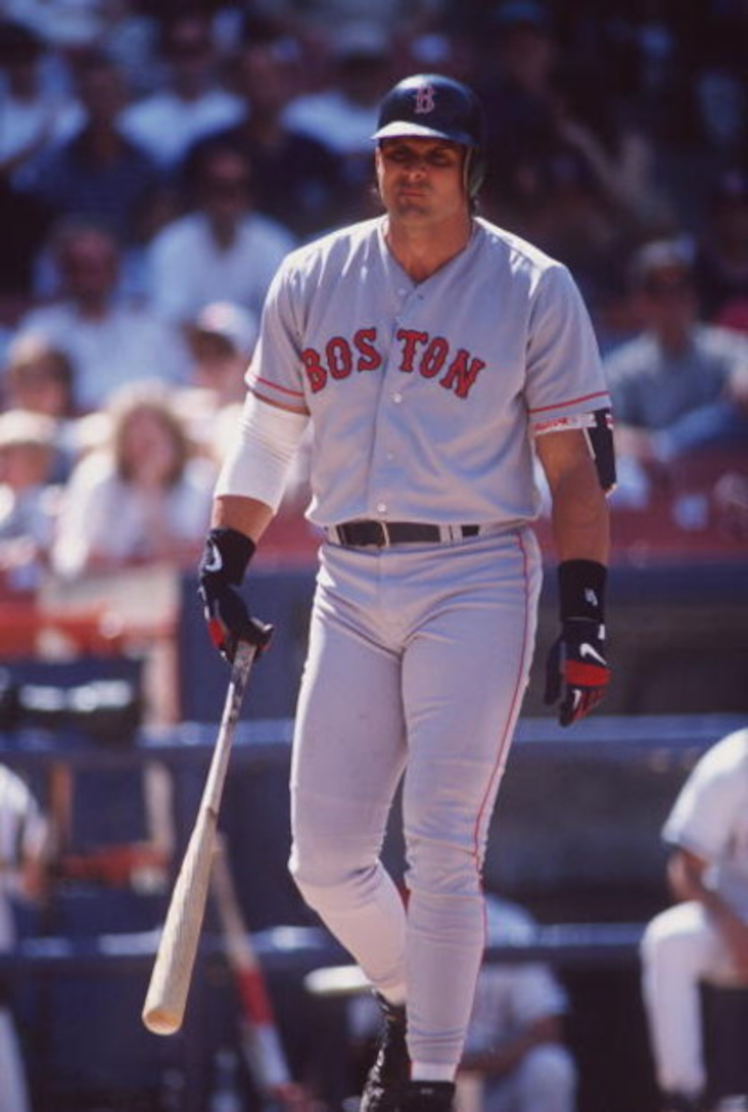 26 May 1996:  Designated hitter Jose Canseco of the Boston Red Sox is visibly frustrated as he walks back to the dug out following an unsuccessful at-bat in the Red Sox 12-2 loss to the California Angeles at Anaheim Stadium in Anaheim, California.   Manda