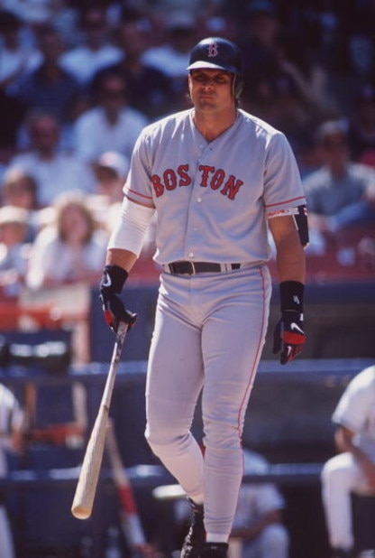 26 May 1996:  Designated hitter Jose Canseco of the Boston Red Sox is visibly frustrated as he walks back to the dug out following an unsuccessful at-bat in the Red Sox 12-2 loss to the California Angeles at Anaheim Stadium in Anaheim, California.   Manda