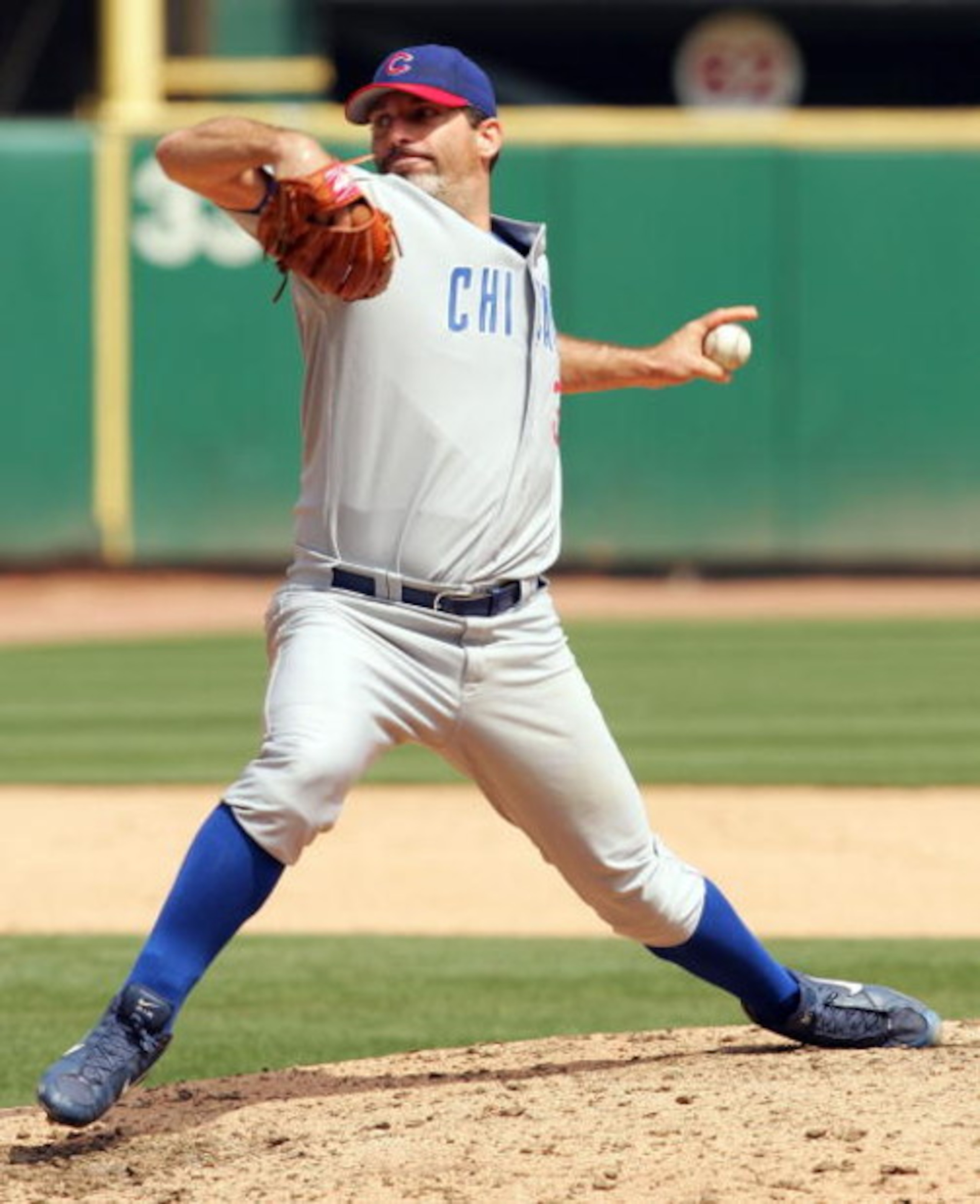 ST. LOUIS - APRIL 21: Mike Remlinger #37 of the Chicago Cubs delivers a pitch in the eighth inning on April 21, 2005 at Busch Stadium in St. Louis, Missouri. The St. Louis Cardinals defeated the Chicago Cubs 4-0.(Photo by Elsa/Getty Images).