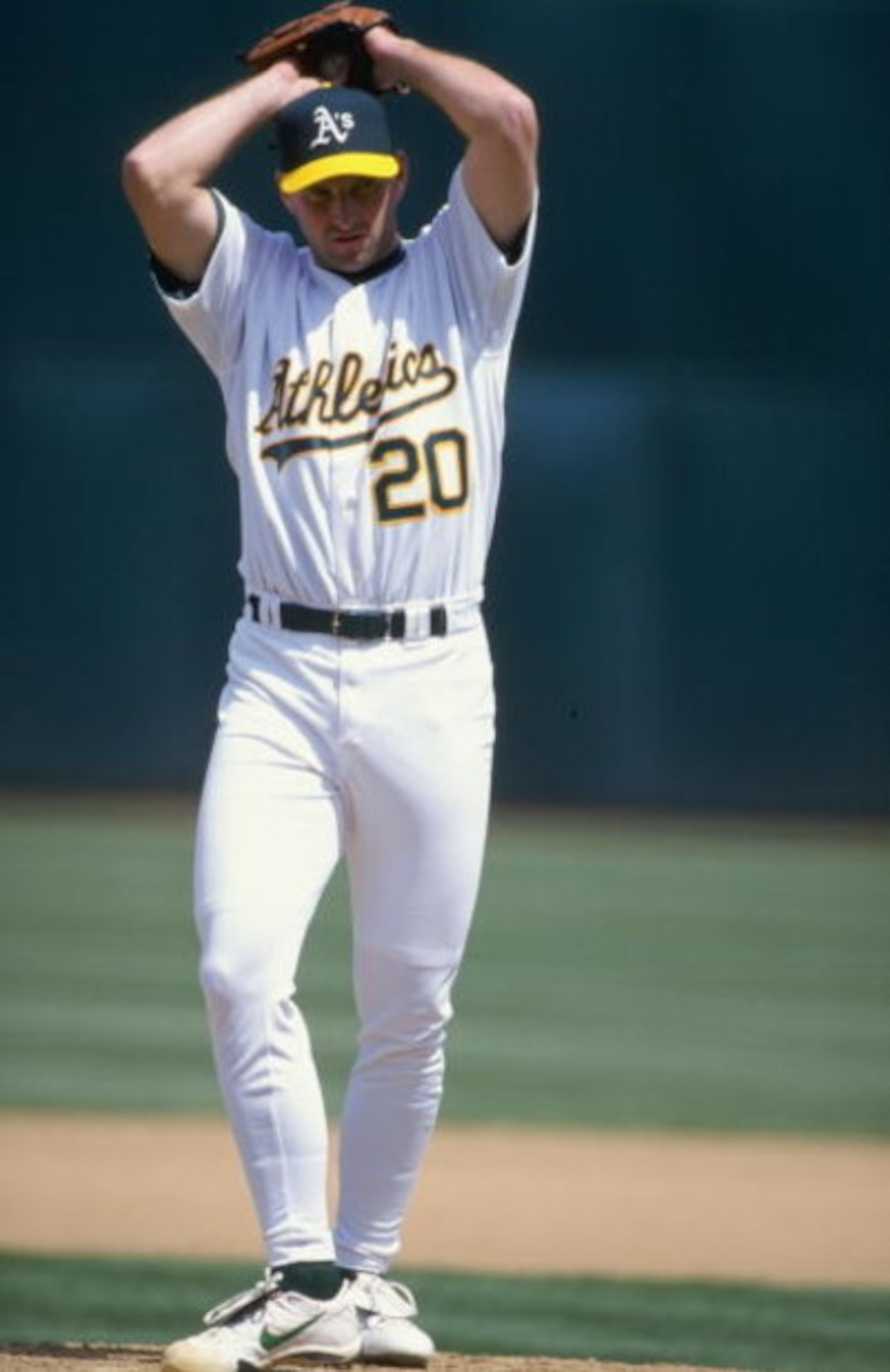 18 Apr 1999:  Pitcher Kevin Jarvis #20 of the Oakland Athletics winds up for the pitch during the game against the Texas Rangers at the Oakland Coliseum in Oakland, California. The Rangers defeated the Athletics 6-2. Mandatory Credit: Jed Jacobsohn  /Alls