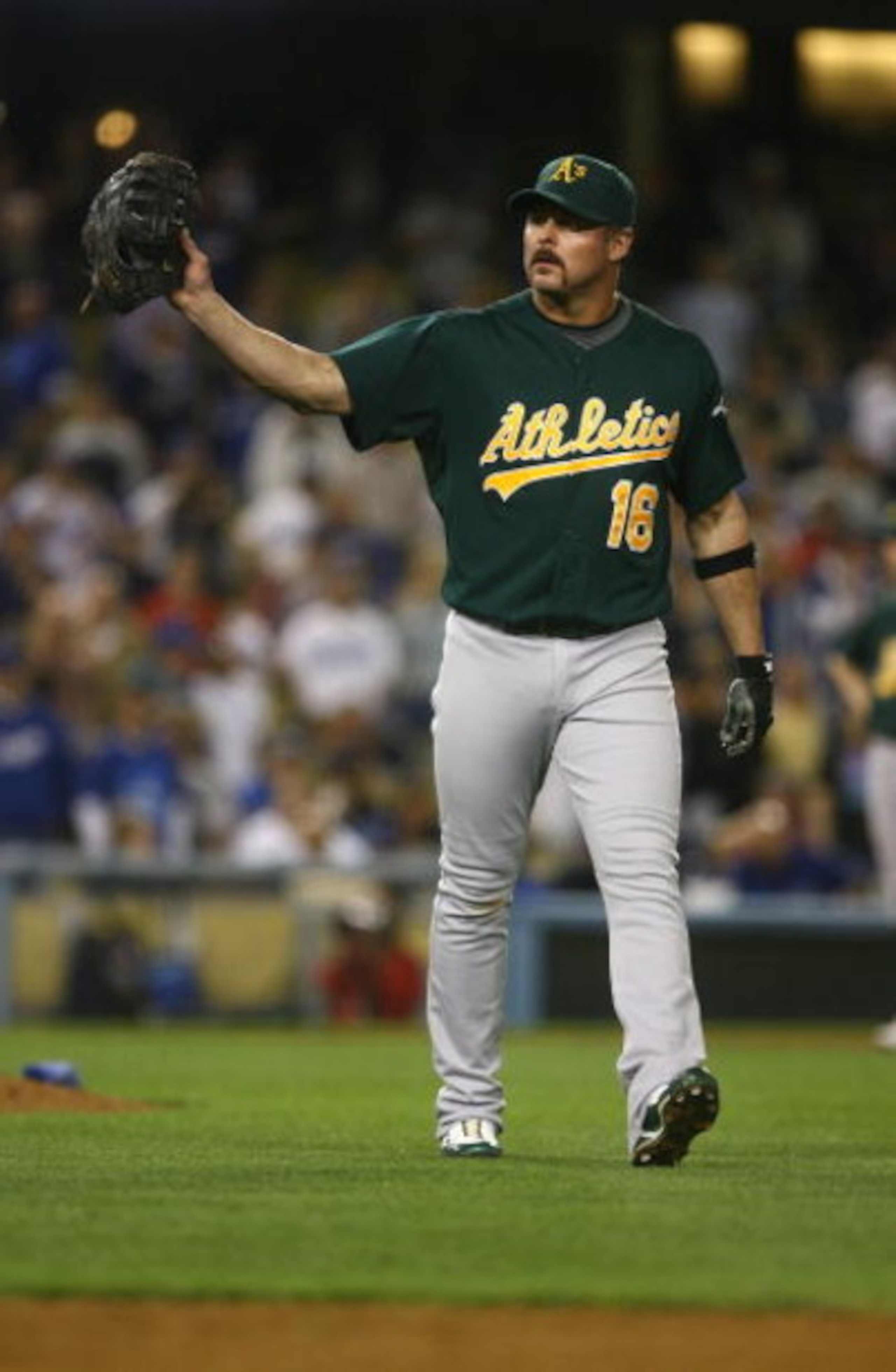 LOS ANGELES, CA - JUNE 16:  Jason Giambi #16 of the Oakland Athletics motions towards the dugout against the Los Angeles Dodgers at Dodger Stadium on June 16, 2009 in Los Angeles, California. The Dodgers defeated the Athletics 5-4 in ten innings.  (Photo 