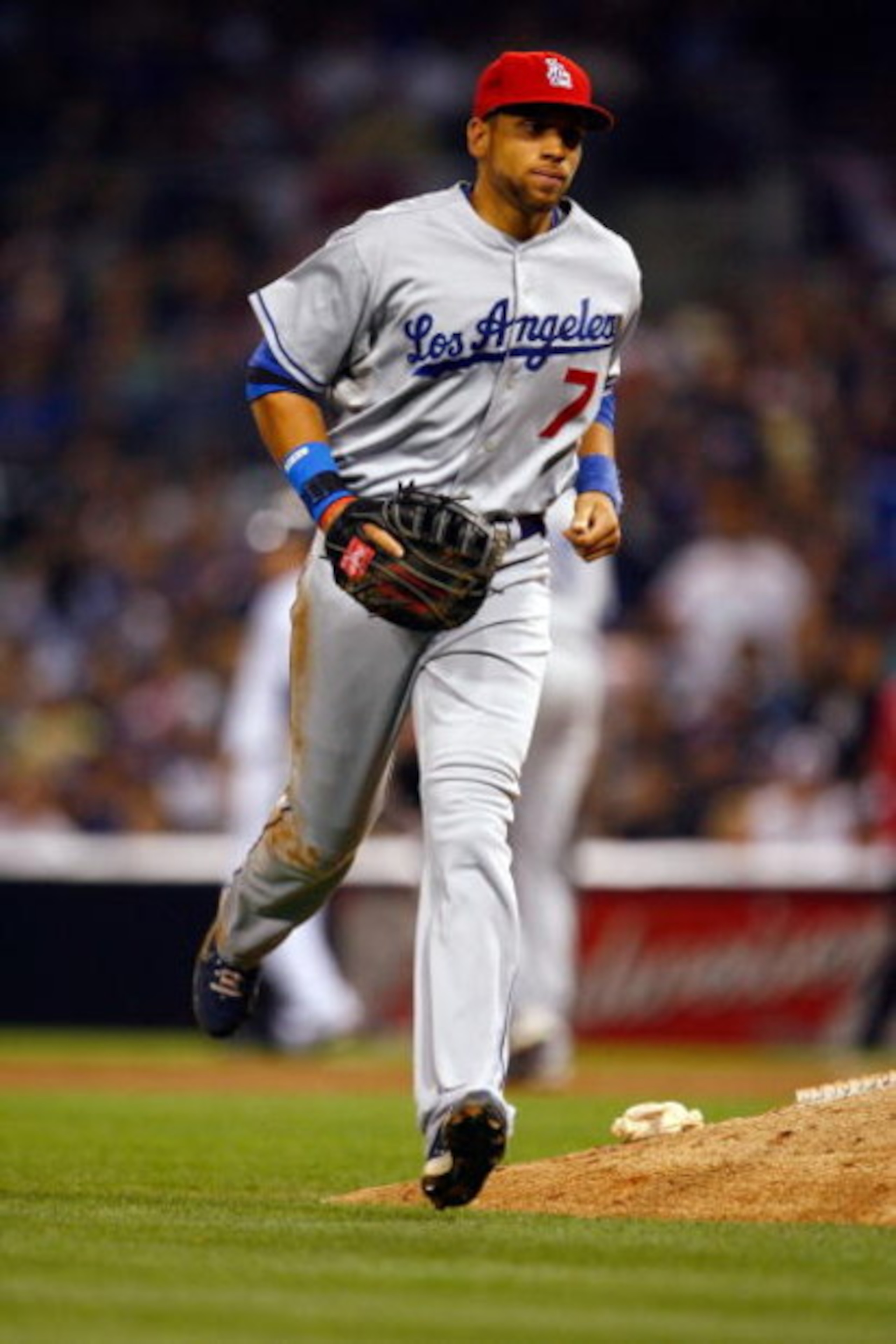 SAN DIEGO - JULY 03:  James Loney #7 of the Los Angeles Dodgers runs back to the dugout during the game against the San Diego Padres at Petco Park on July 3, 2009 in San Diego, California.  (Photo by Jeff Gross/Getty Images)