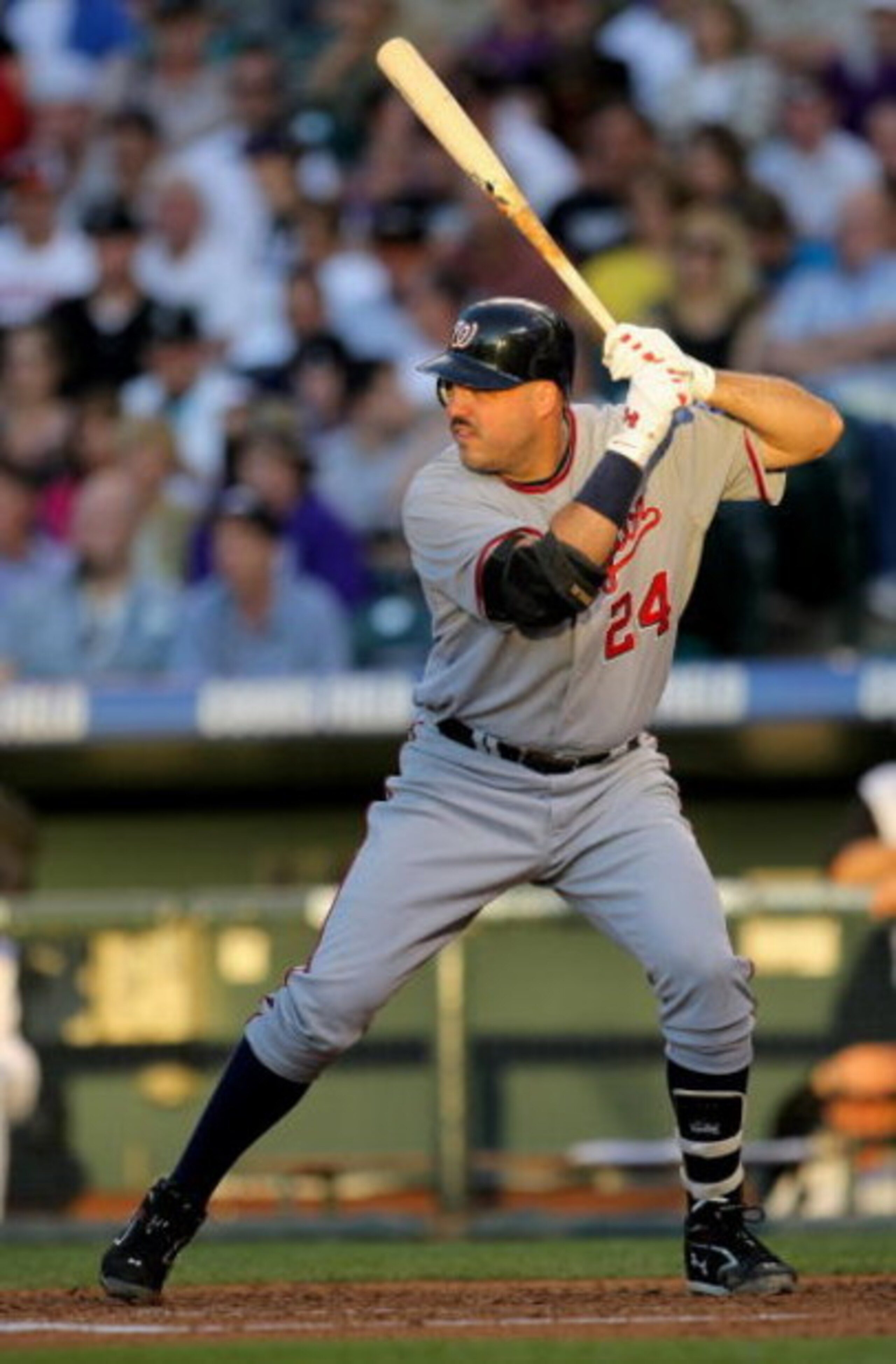 DENVER - JULY 06:  Nick Johnson #24 of the Washington Nationals takes an at bat against the Colorado Rockies during MLB action at Coors Field on July 6, 2009 in Denver, Colorado. The Rockies defeated the Nationals 1-0.  (Photo by Doug Pensinger/Getty Imag