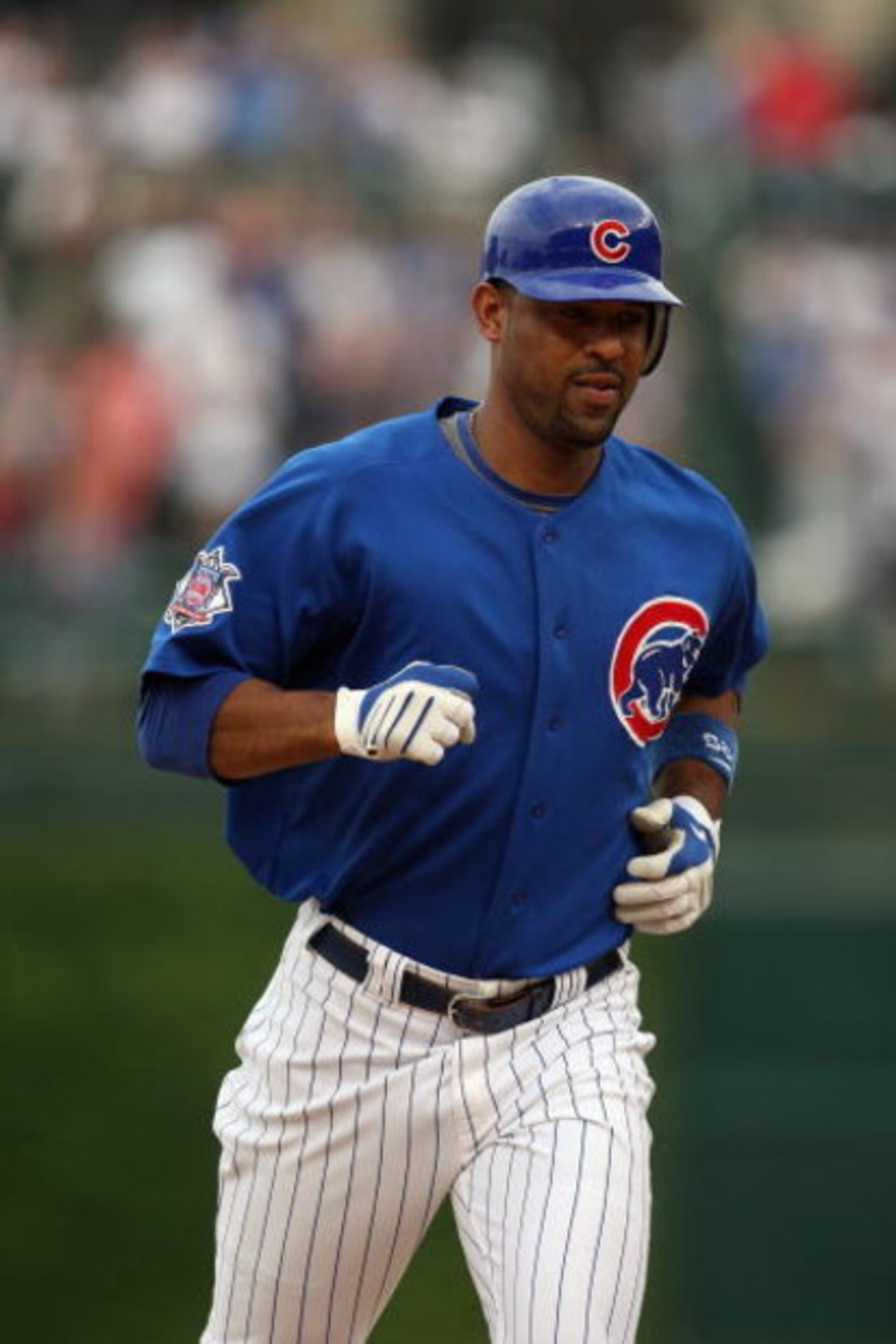 CHICAGO - JUNE 18:  Derrek Lee #25 of the Chicago Cubs rounds the bases after hitting a home run against the Chicago White Sox during the game on June 18, 2009 at Wrigley Field in Chicago, Illinois. (Photo by Jonathan Daniel/Getty Images)